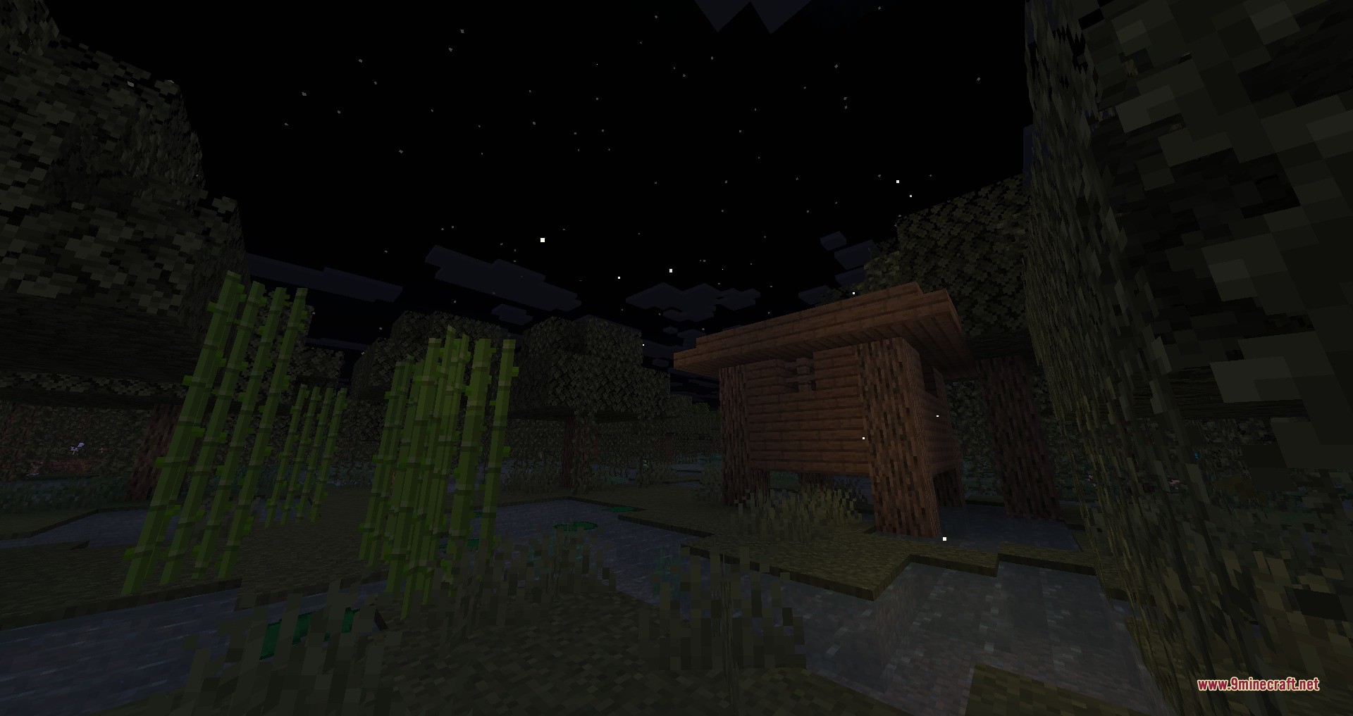 Lawrence's Ambient Fireflies Data Pack Screenshot 2 Ambient fireflies float near sugar cane and a wooden hut at night