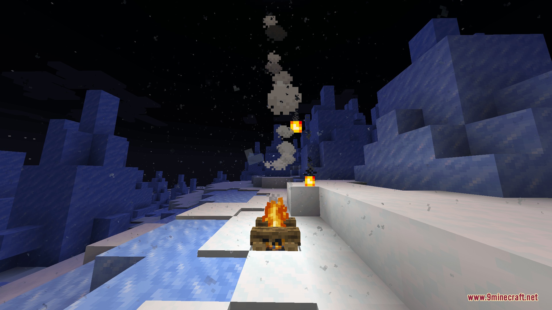 Light Dust Mod Screenshot 3 A campfire burning on snow at night with floating dust particles