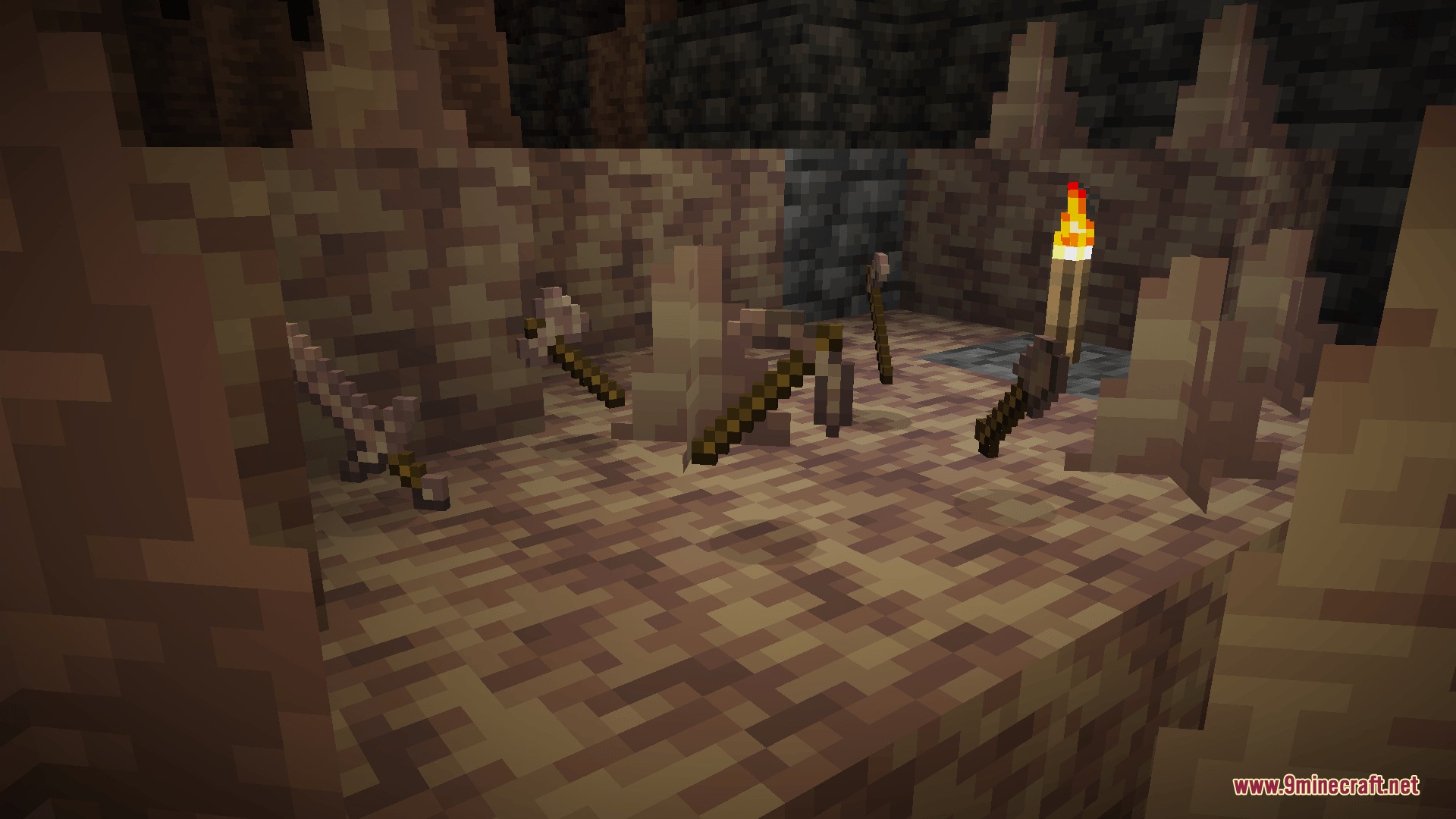 Lithic Edge Customry Mod Screenshot 8 Stone tools are stuck in the ground near pointed dripstone and a torch