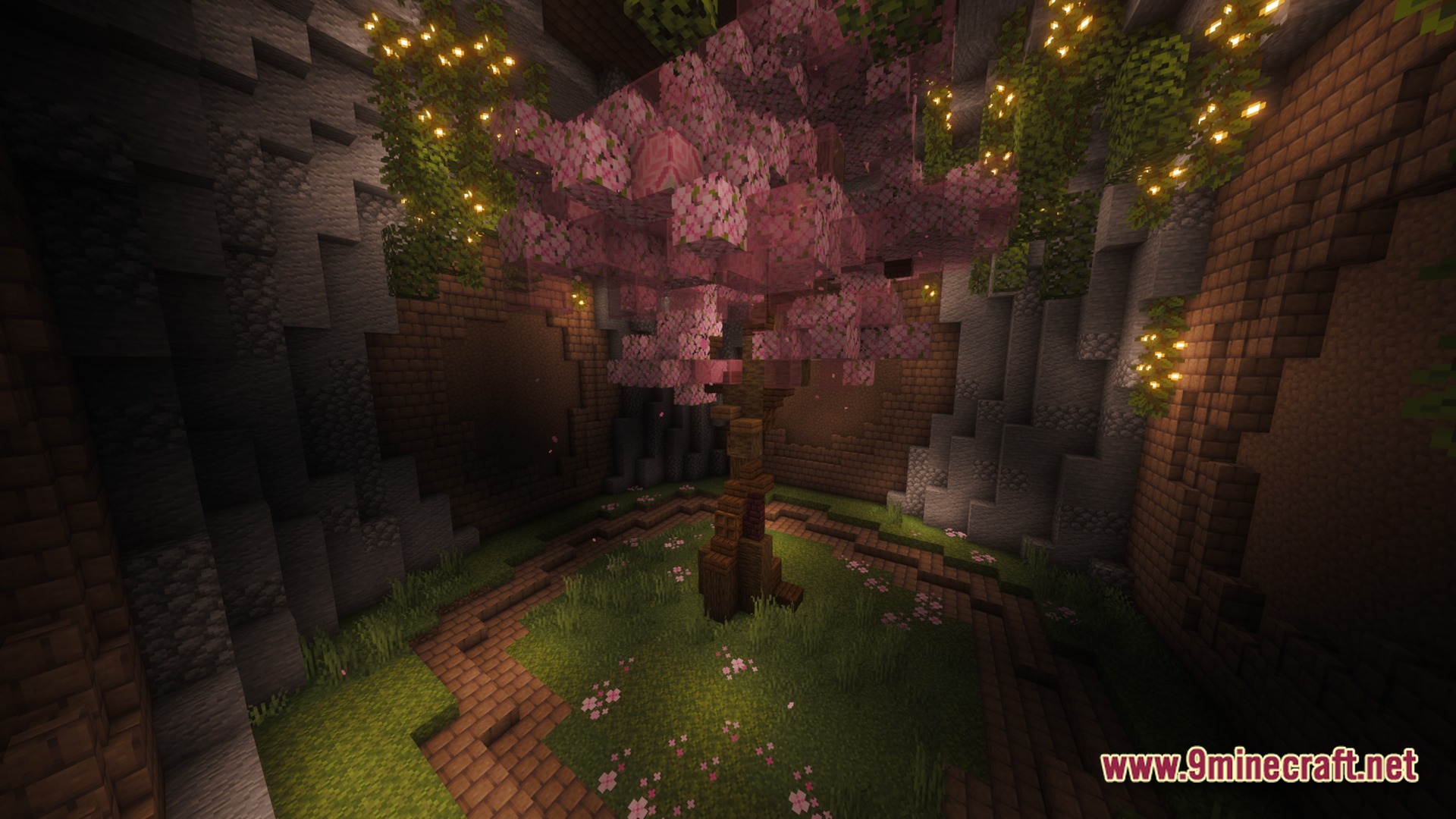 Lithic Vault Trials Modpack Screenshot 9 A cherry blossom tree grows in an underground stone chamber illuminated by glowing vines