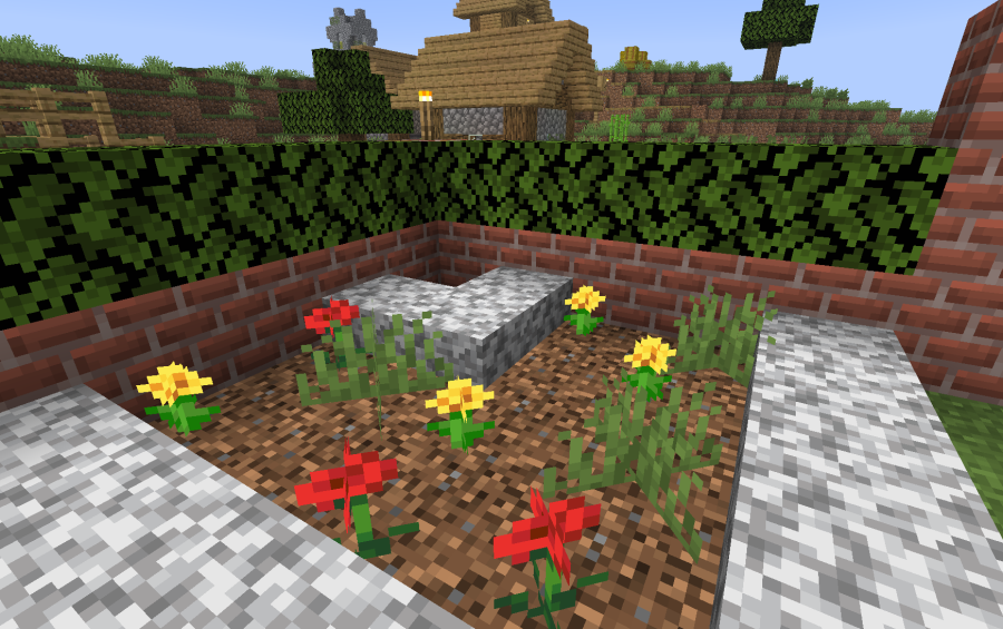 Close up of a flower bed with red and yellow flowers