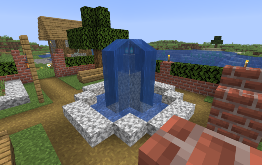 A central water fountain surrounded by diorite blocks and a brick wall