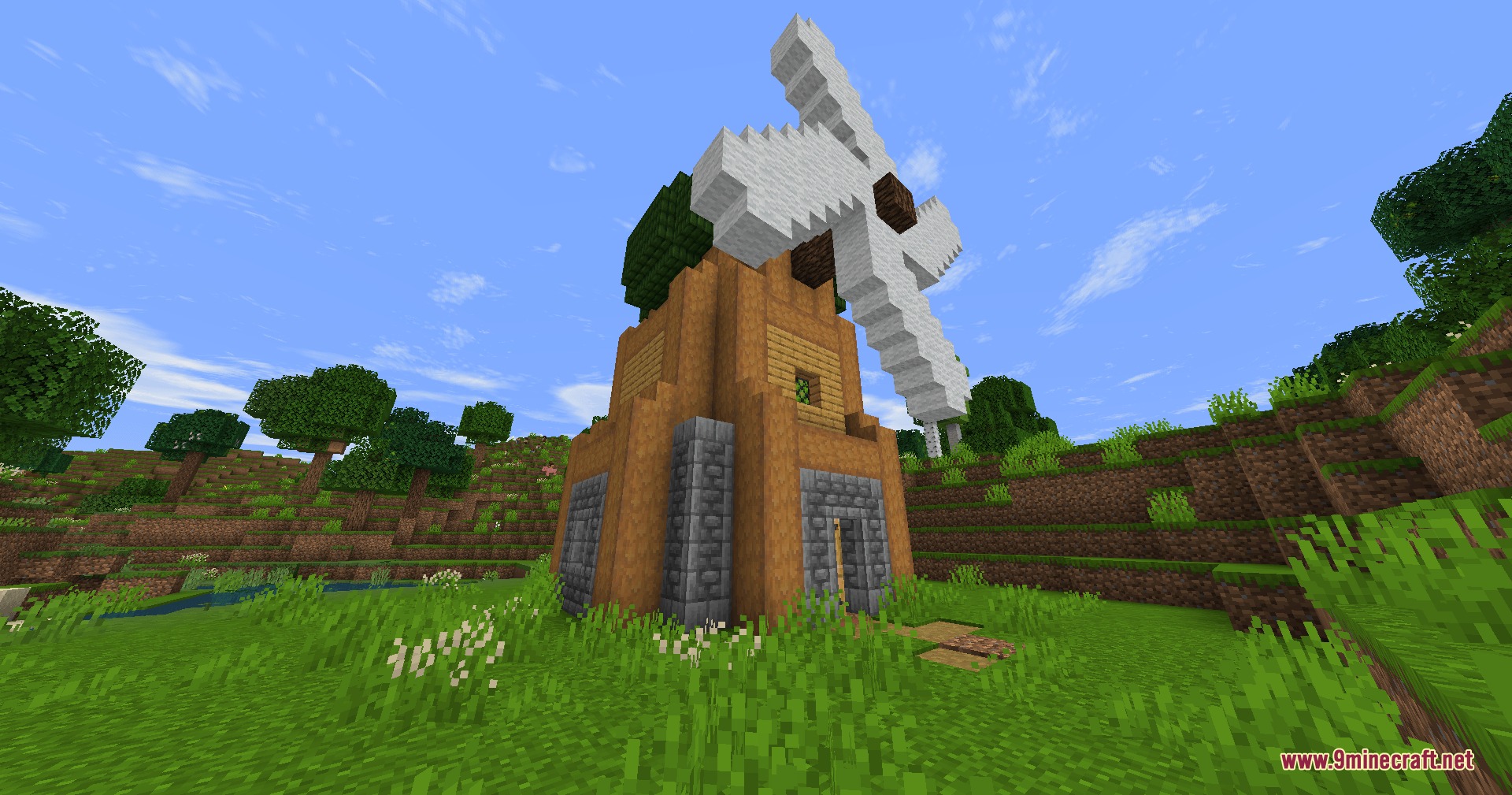 Lord of the Rings Renewed Extended Mod Screenshot 5 A tall wooden windmill with white sails stands in a grassy field