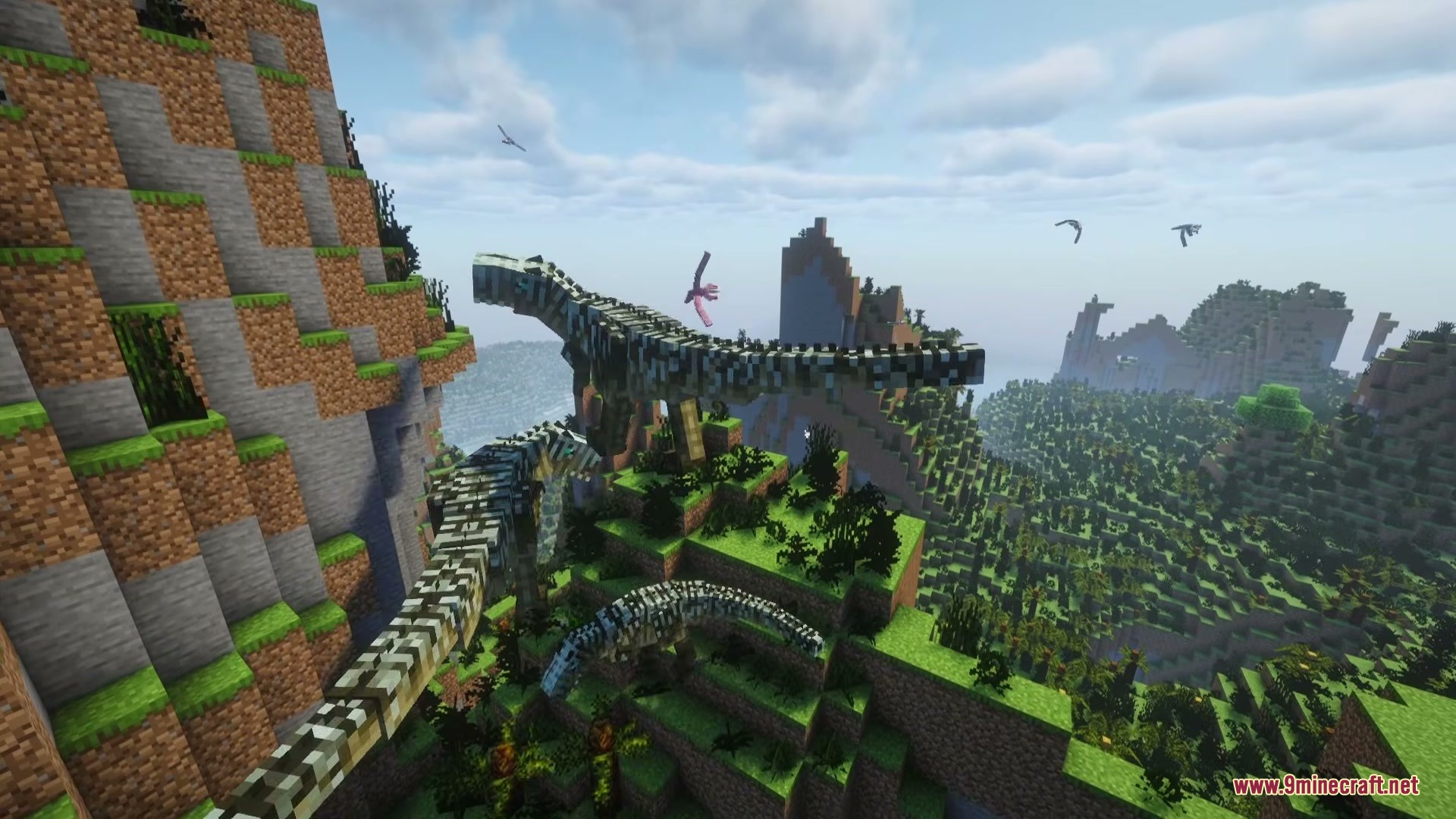 Prehistoric dinosaurs and flying creatures roaming a mountainous Minecraft landscape