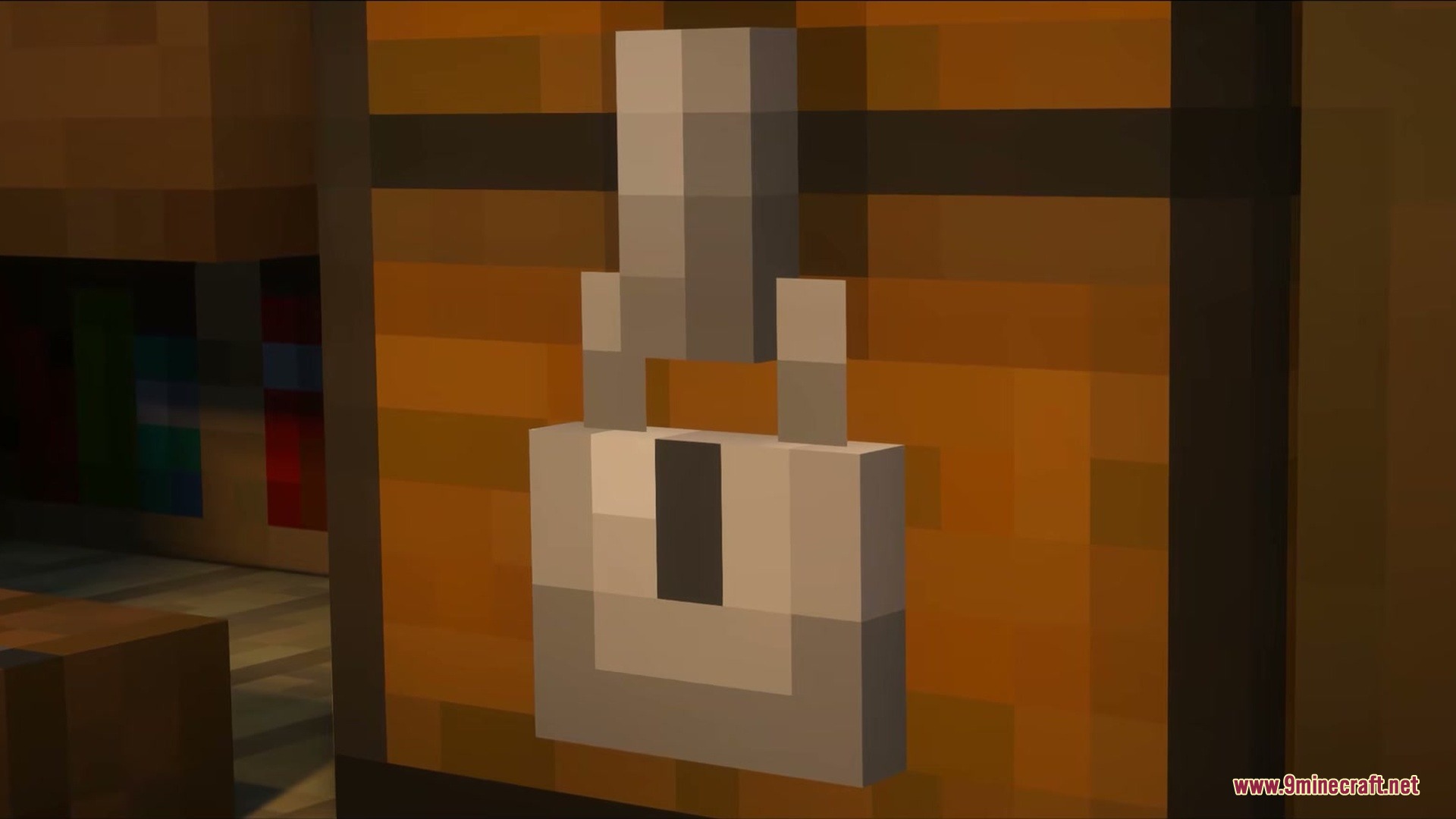 Lucky's Locksmith Mod Screenshot 1 A wooden Minecraft chest secured with a large grey metal padlock