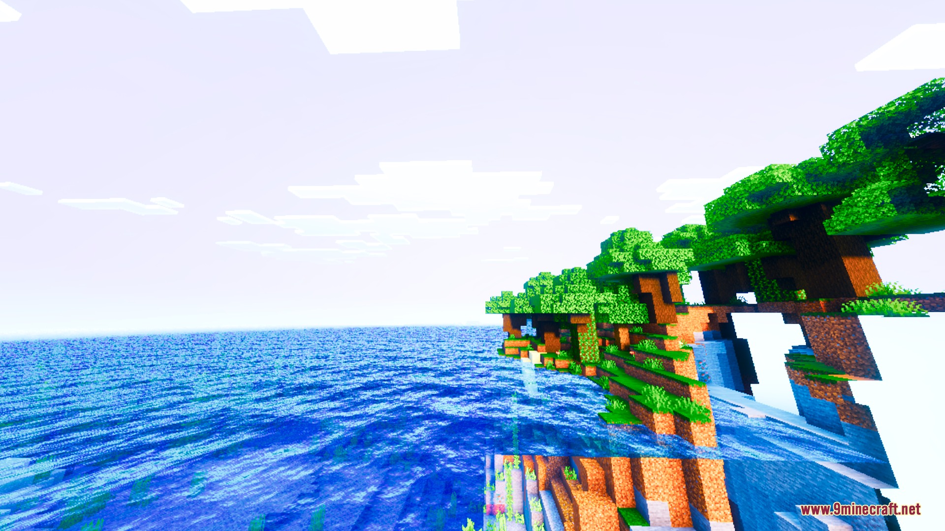 Lumina Prism Visuals Shader Screenshot 1 Lush green trees on a cliff overlooking a bright blue and clear ocean
