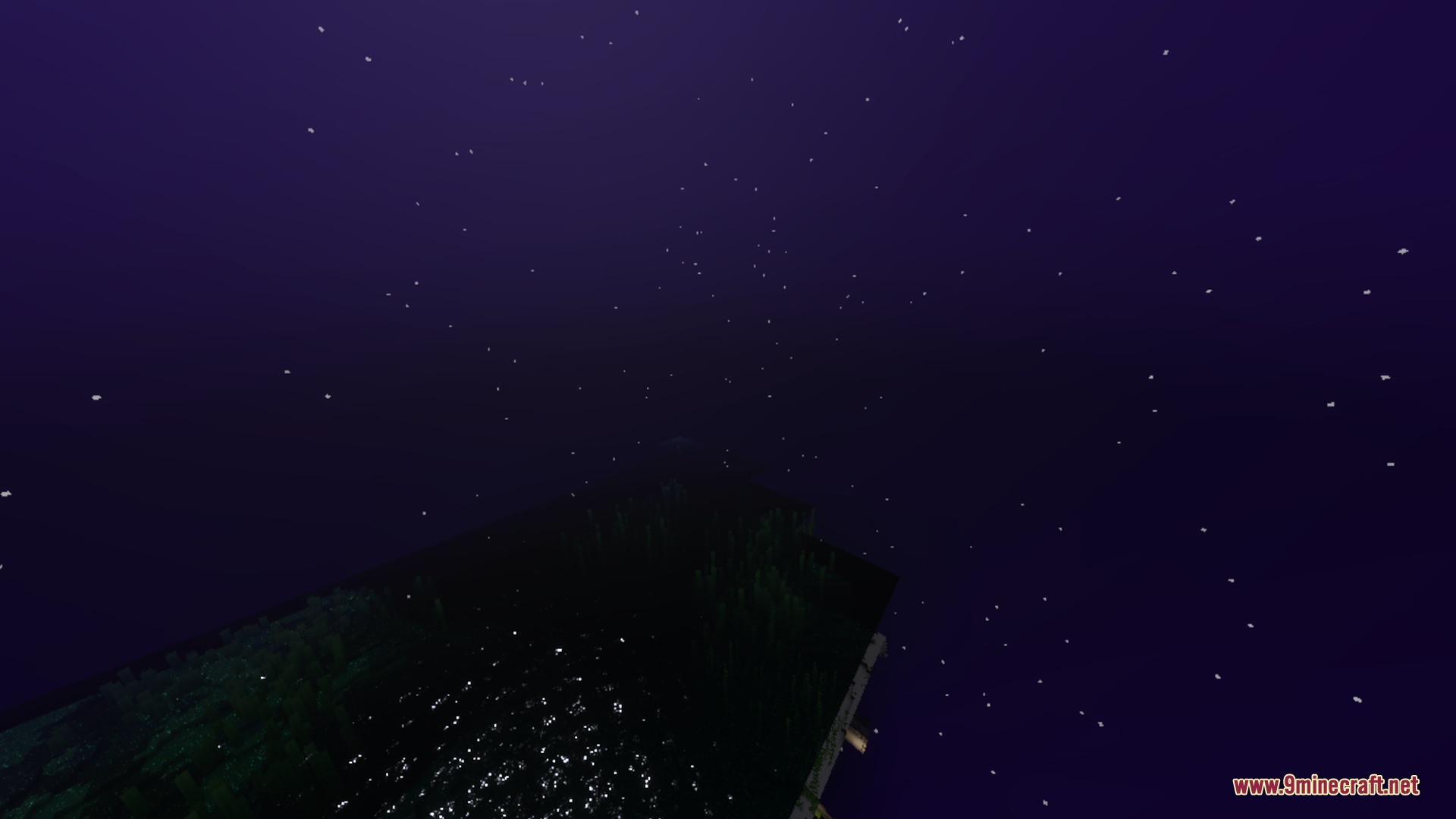 Deep purple night sky with numerous stars shining over a dark landscape