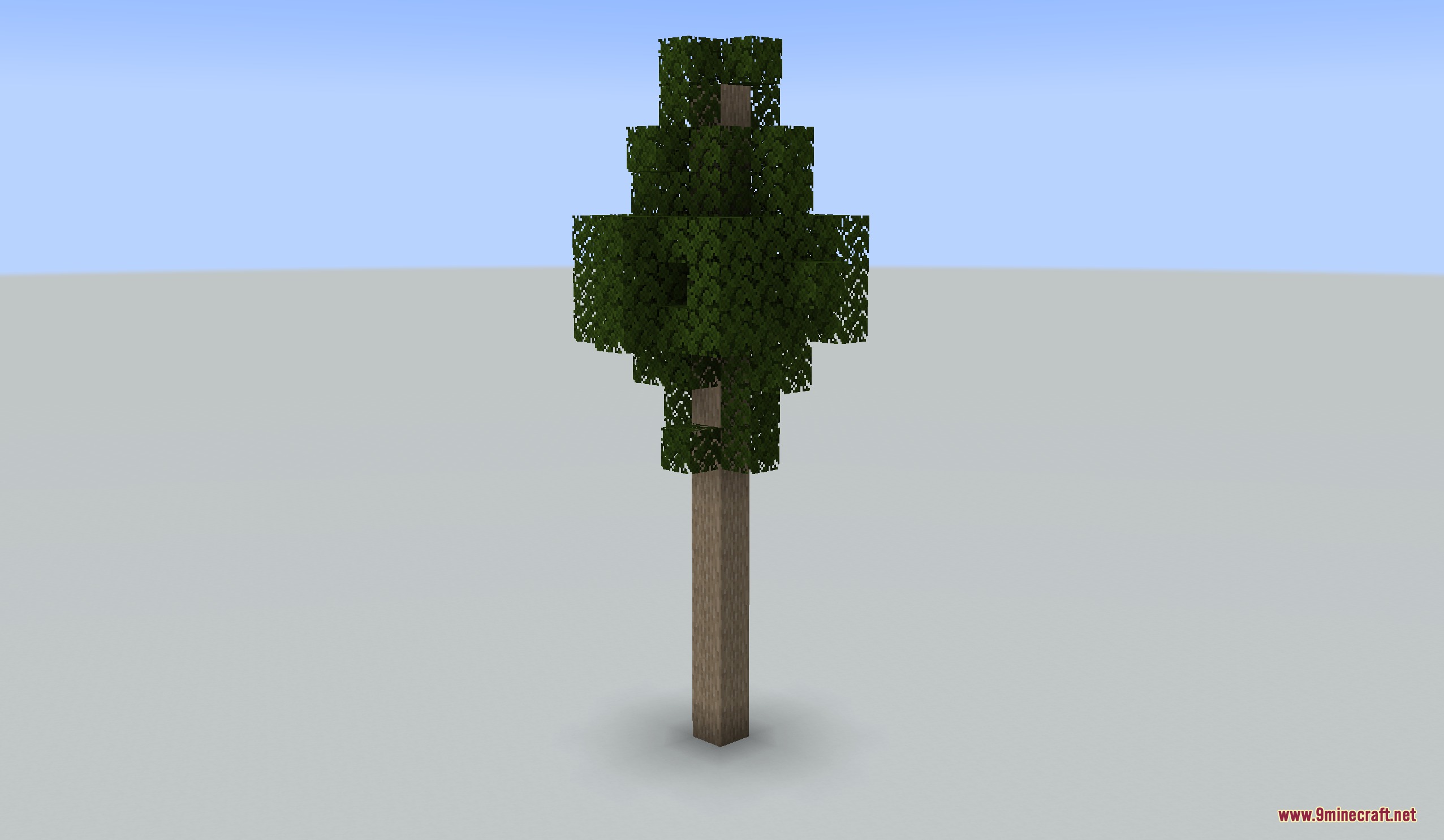 A tall custom tree with dark wood and green leaves