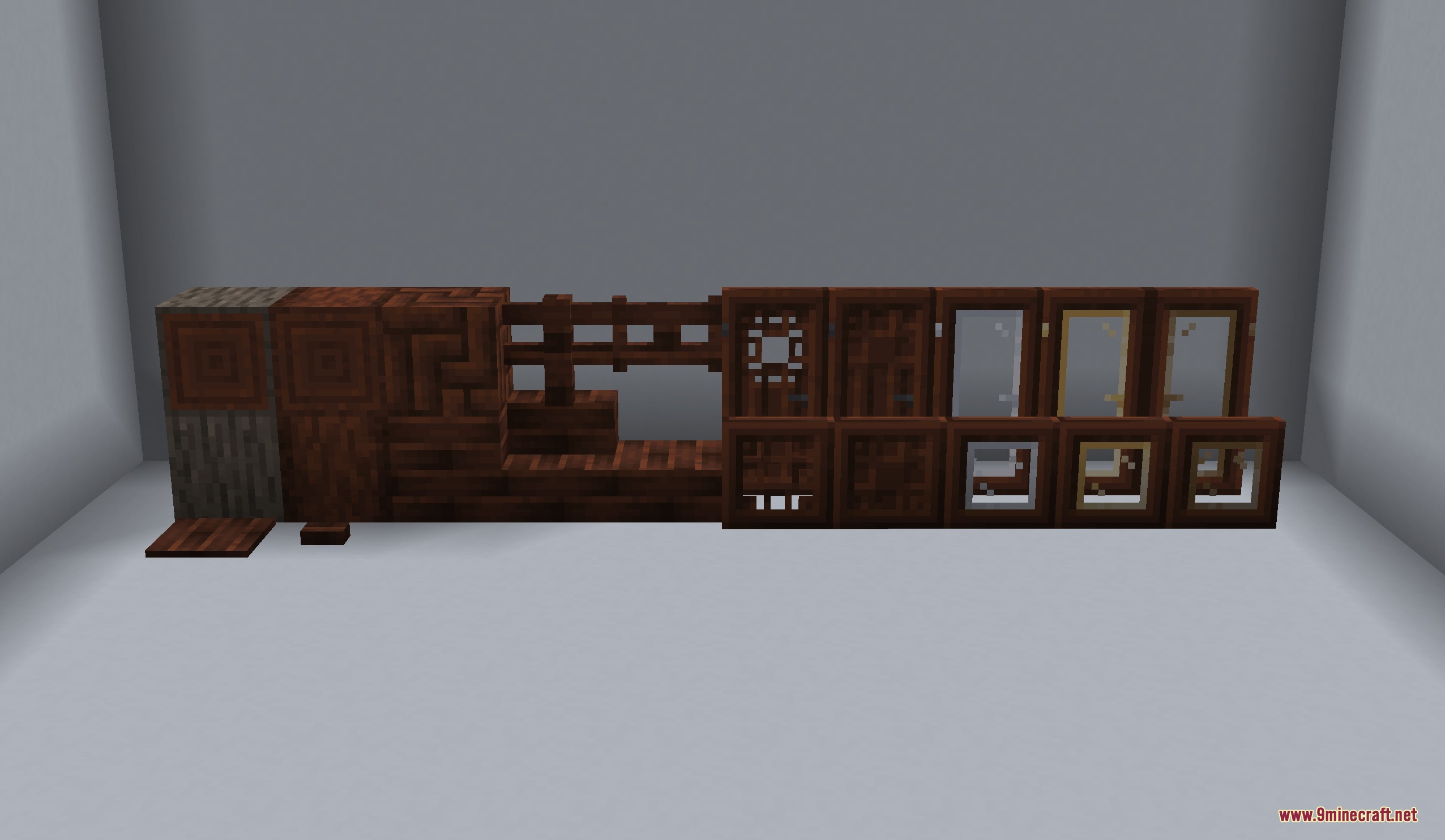A collection of dark wood building blocks and decorative glass doors