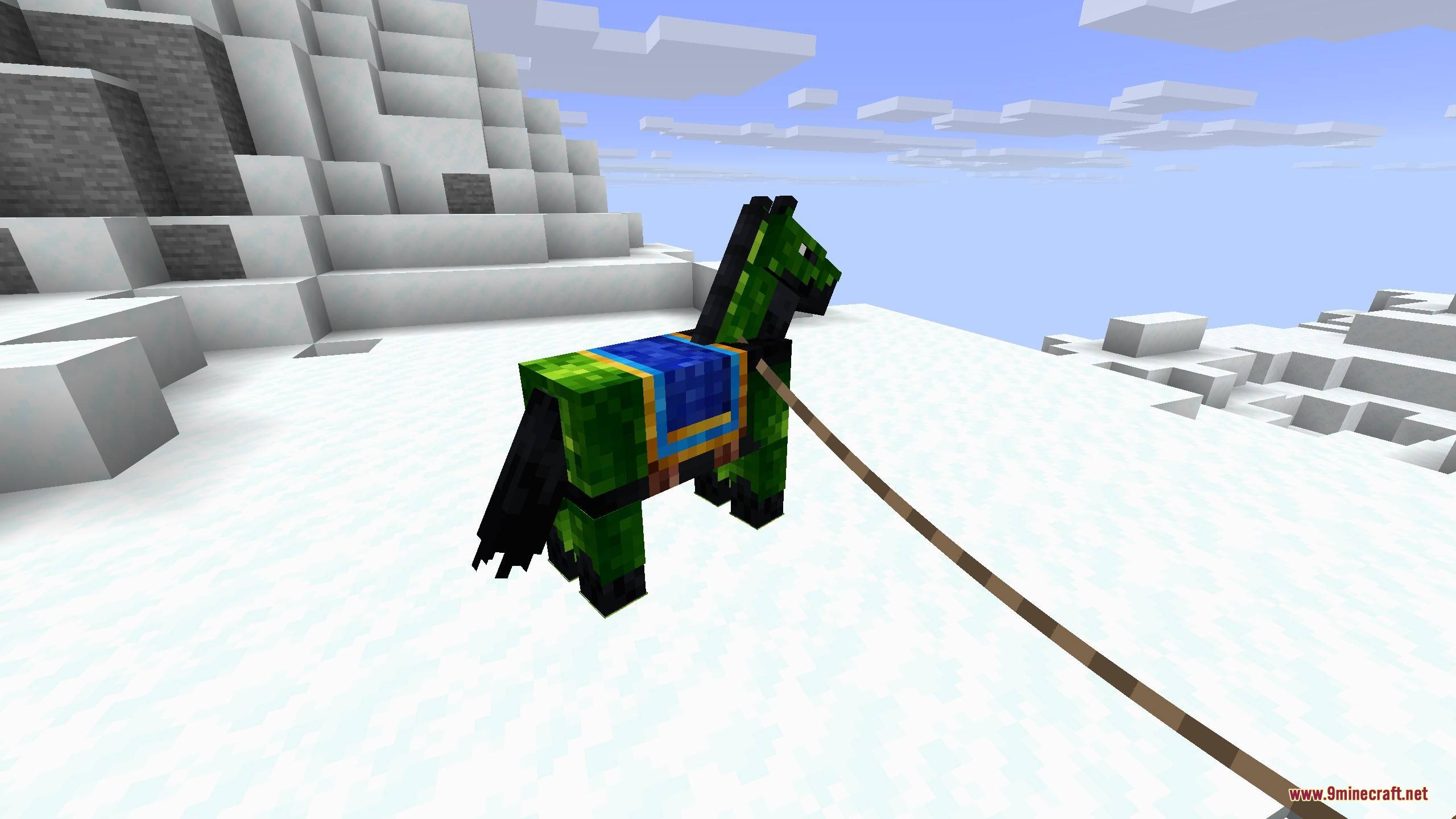 A horse wearing green Lymonite armor stands on a snowy mountain peak