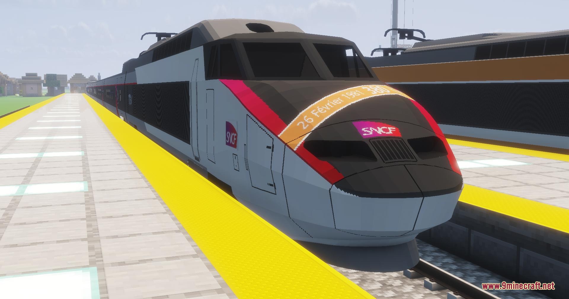 A modern grey and red TGV train at a Minecraft station platform