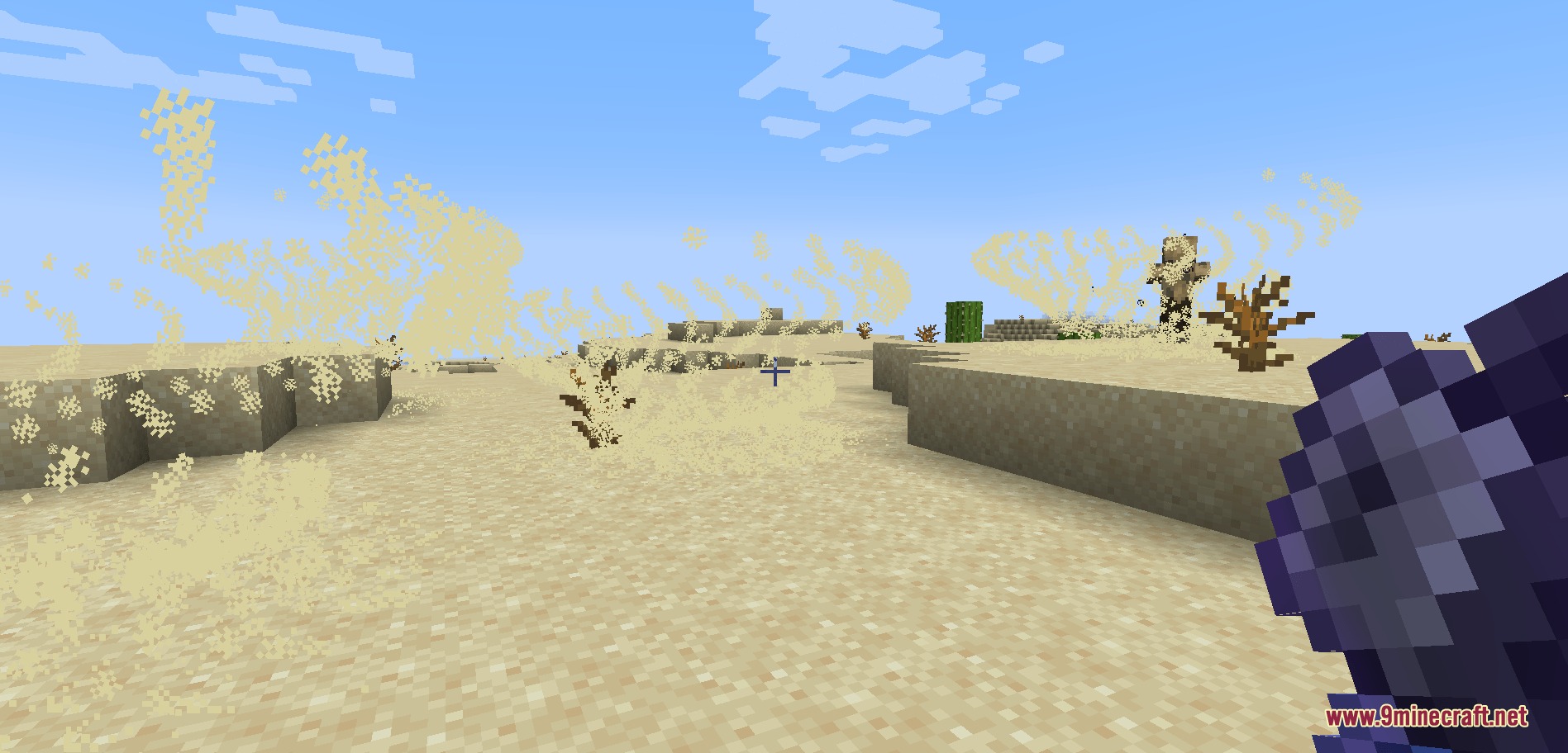 A player wielding a powerful mace while a sandstorm rages in the desert