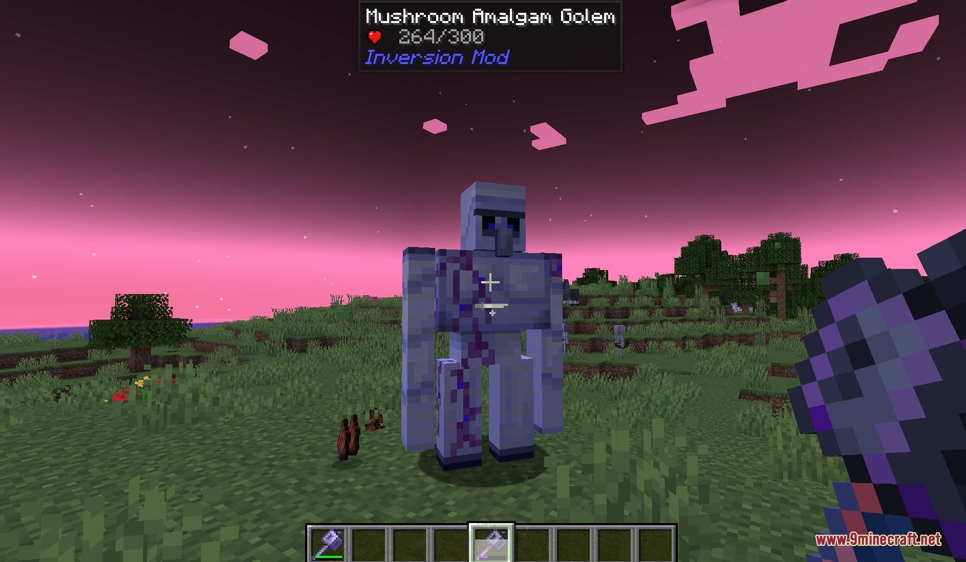 A Mushroom Amalgam Golem stands in a field under a pink sky