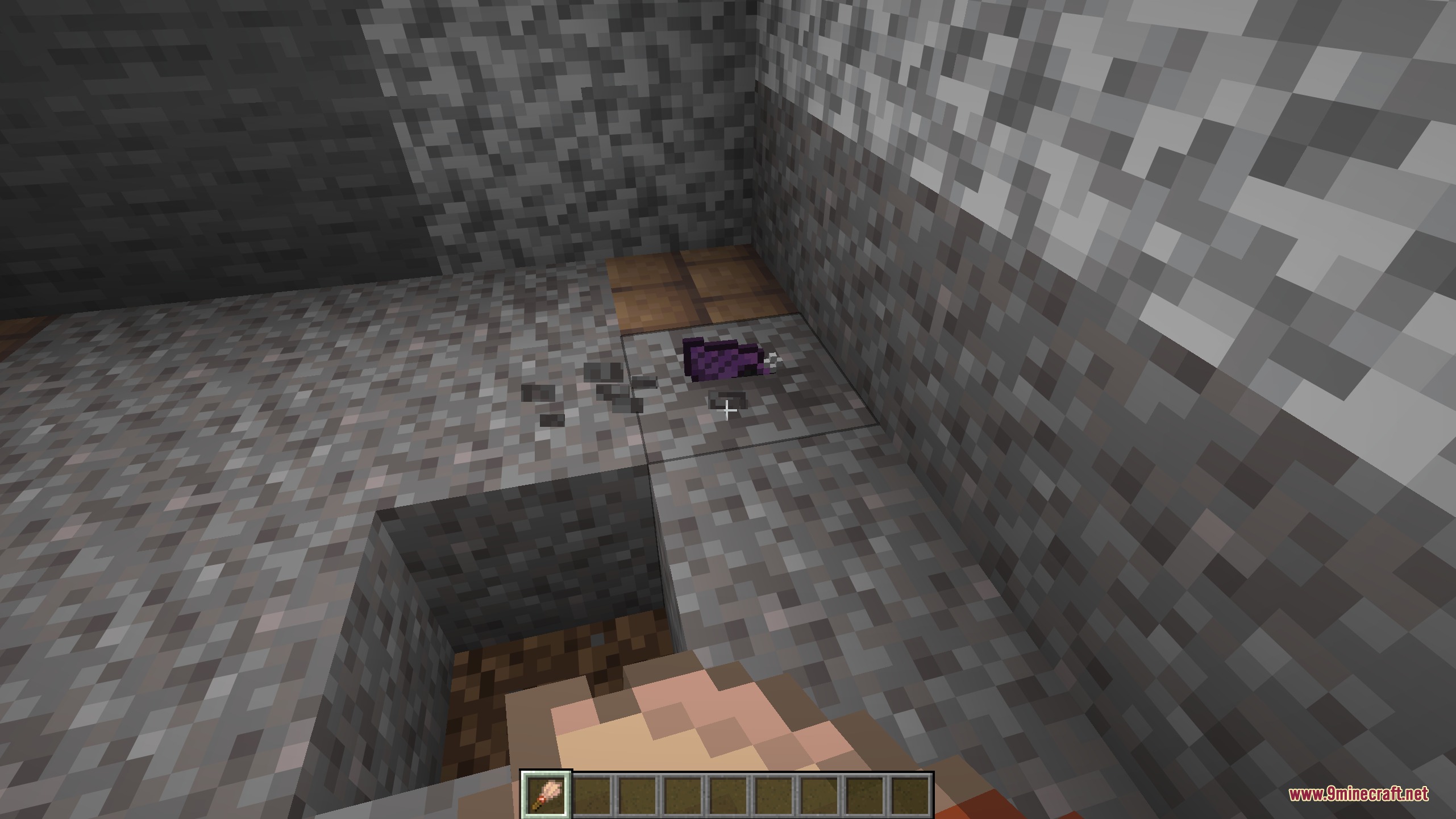 Magic Conch Shell Mod Screenshot 3 A purple shell item lies on the gravel ground inside a cave