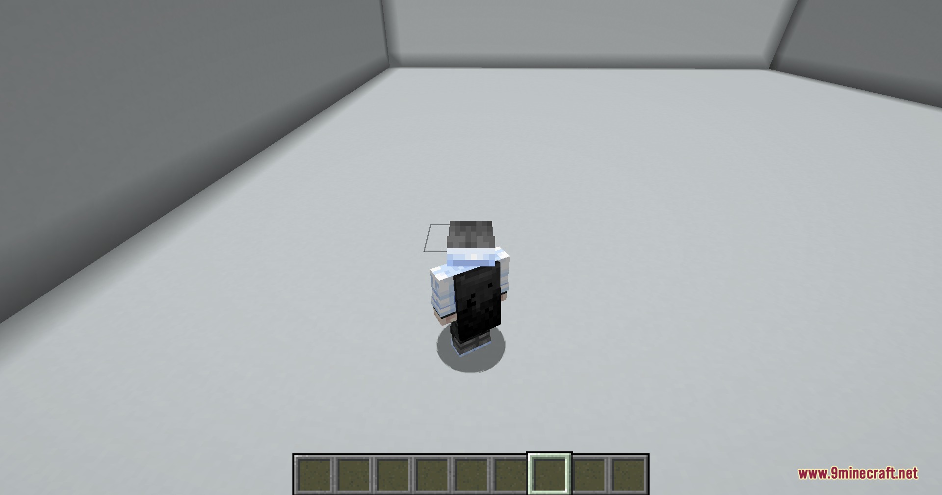 A Minecraft player character wearing a black cape in a simple gray room