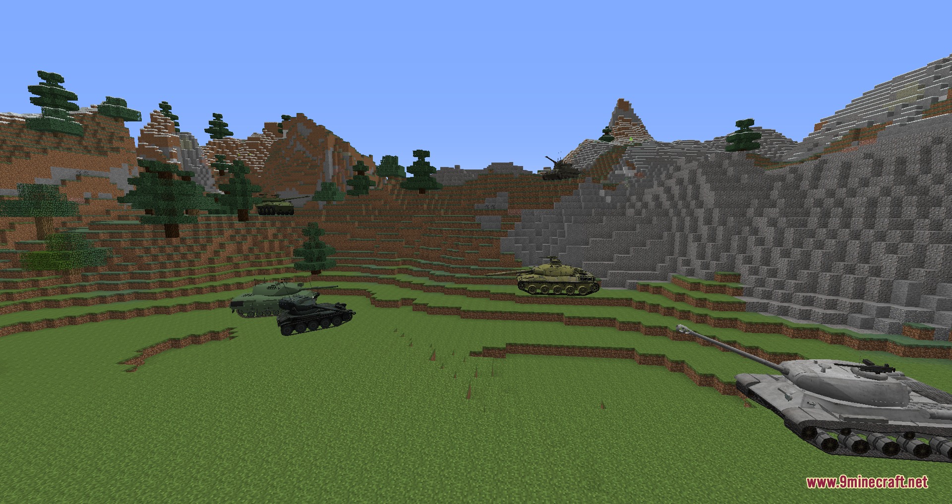 Mcheli Overdrive Loader Mod Screenshot 8 Several different types of tanks parked on a grassy mountain landscape