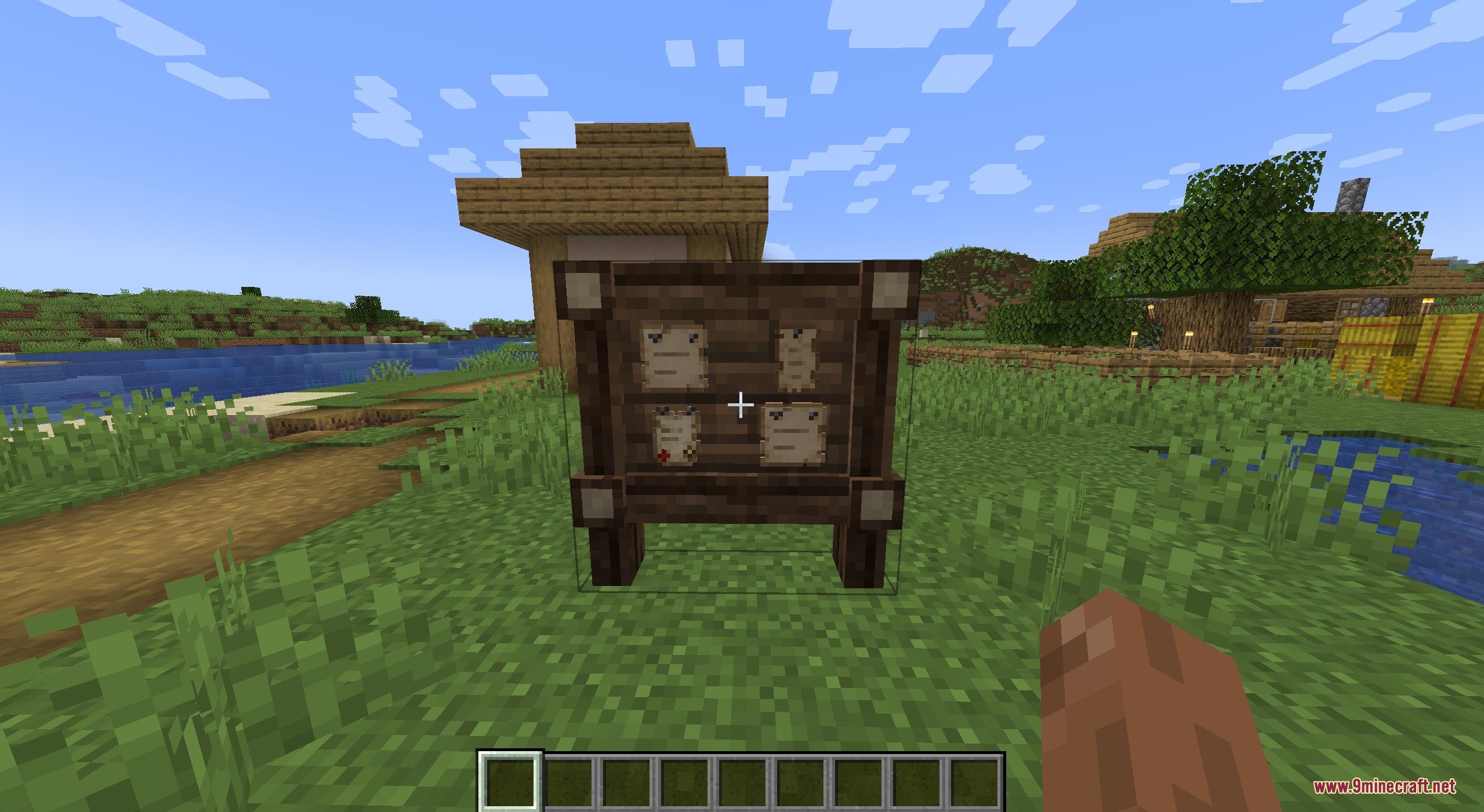 Mebahel's RPG Villager Quests and Companions Mod Screenshot 2 A wooden quest board with paper contracts stands in a grassy village