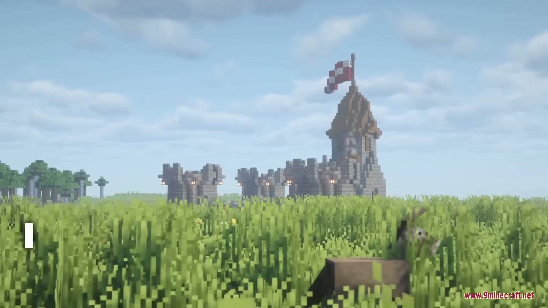 Middle Age Castles Mod Screenshot 1 A large medieval castle structure standing in a vast green grassy field