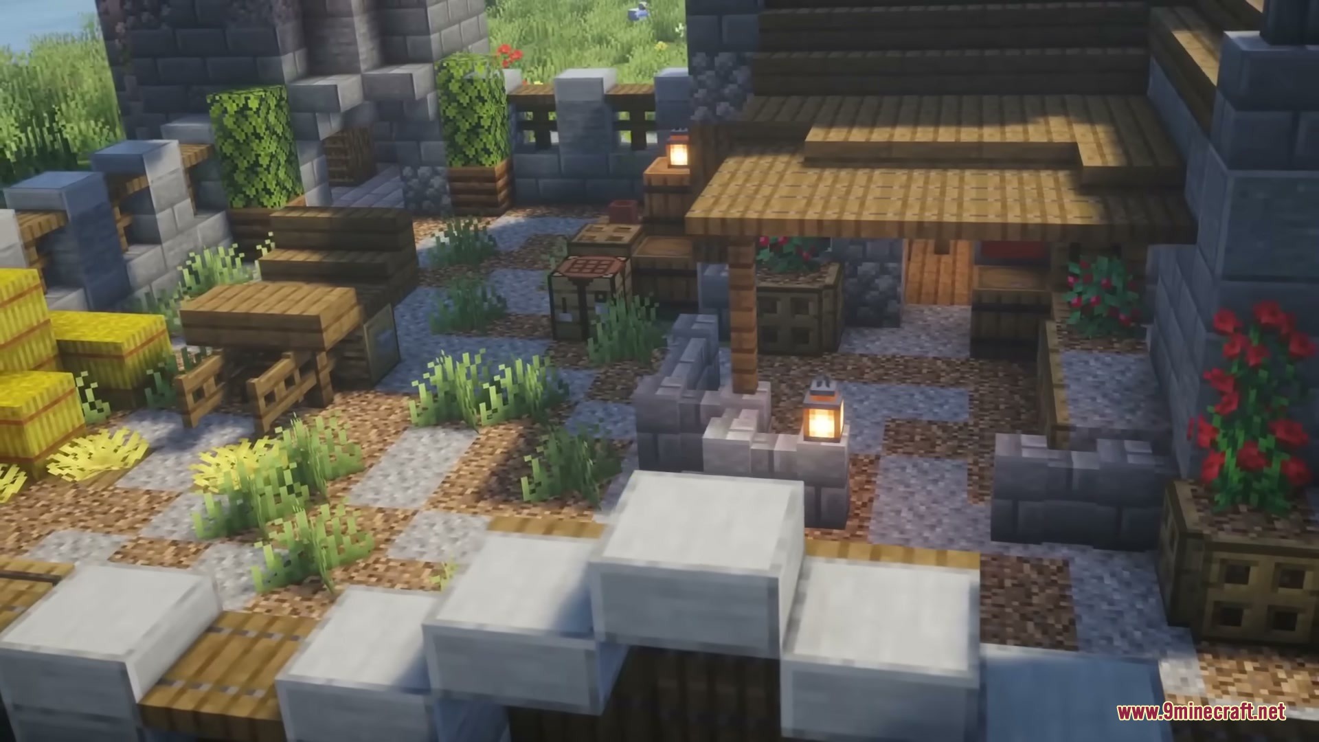 Middle Age Castles Mod Screenshot 2 A cozy castle courtyard featuring stone paths wooden furniture and decorative plants
