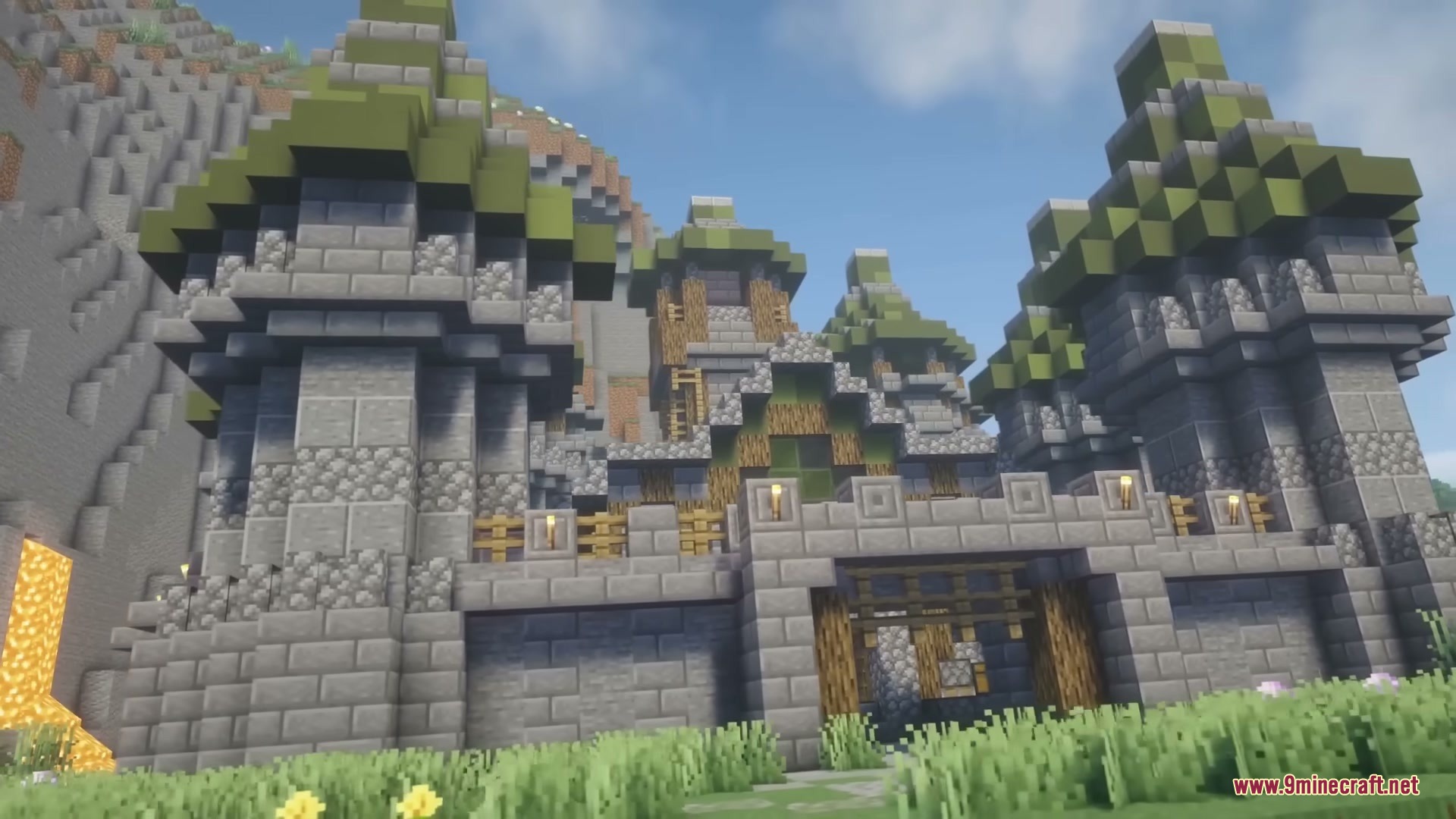 Middle Age Castles Mod Screenshot 3 Large medieval castle structure with green roofs and stone walls near a mountain