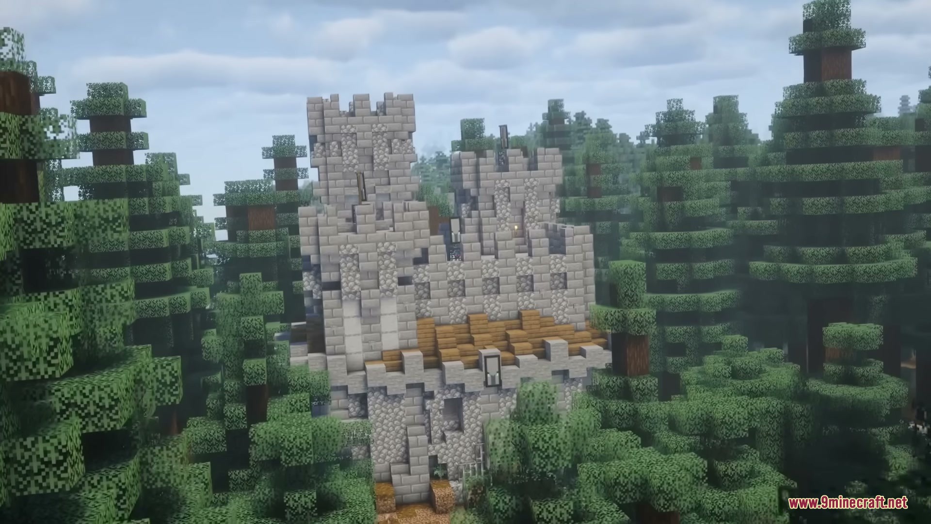Middle Age Castles Mod Screenshot 5 A large medieval stone castle stands tall among dense spruce trees