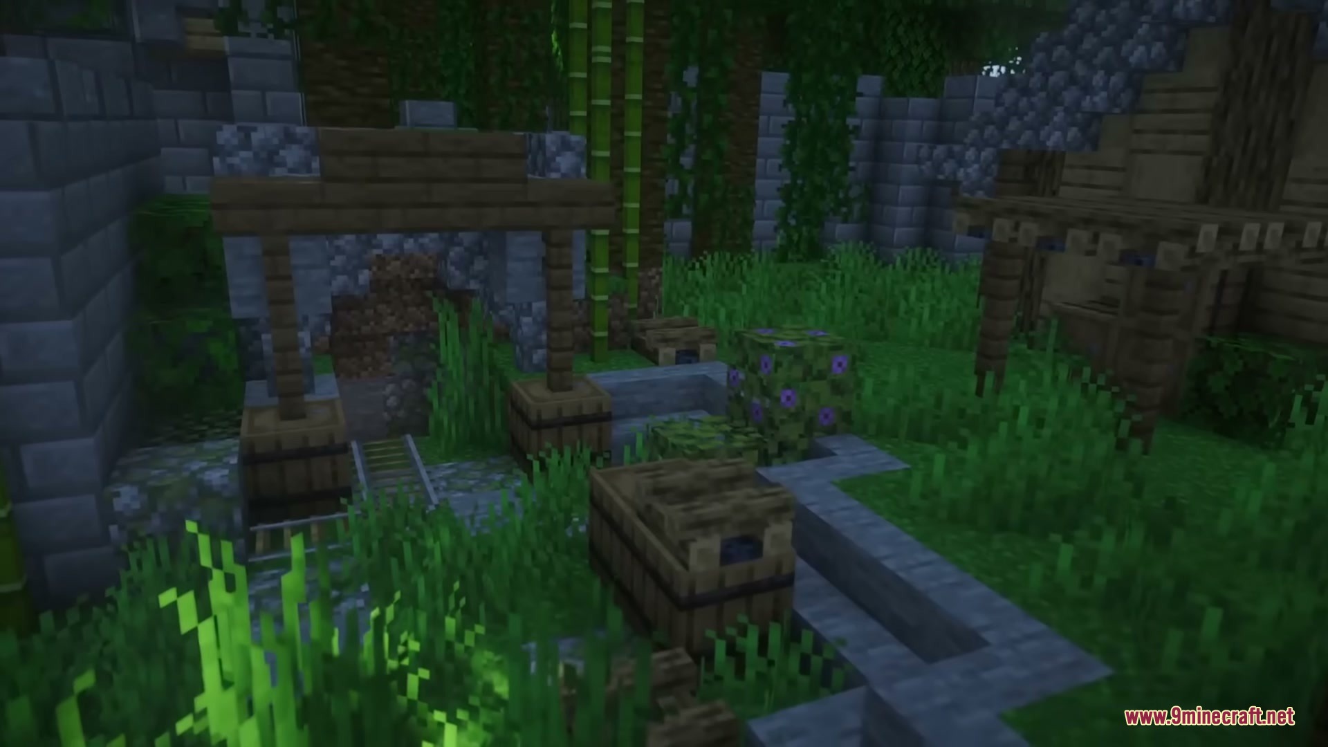 Middle Age Castles Mod Screenshot 6 A stone mine entrance with rails and barrels inside a castle courtyard