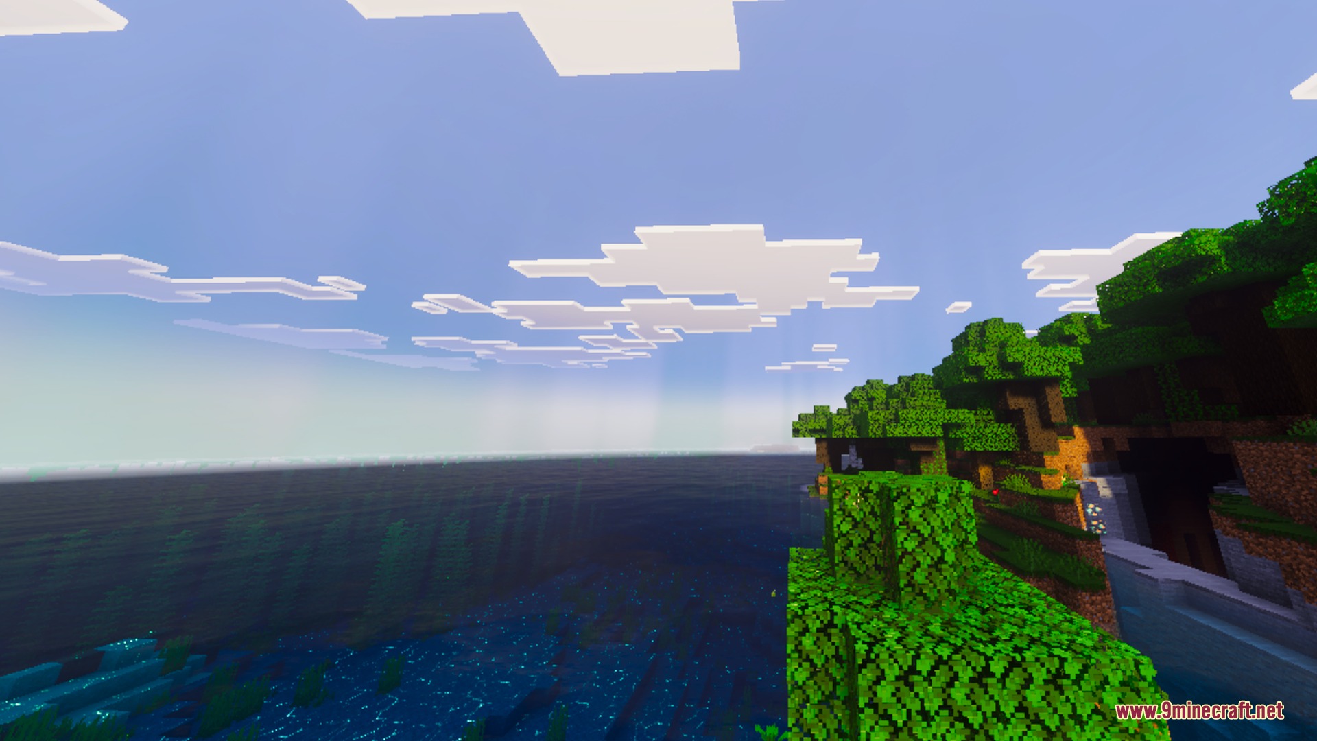 Mike Ultra Visuals Shader Screenshot 2 Lush green trees on a cliff overlooking a vast ocean under a bright sky