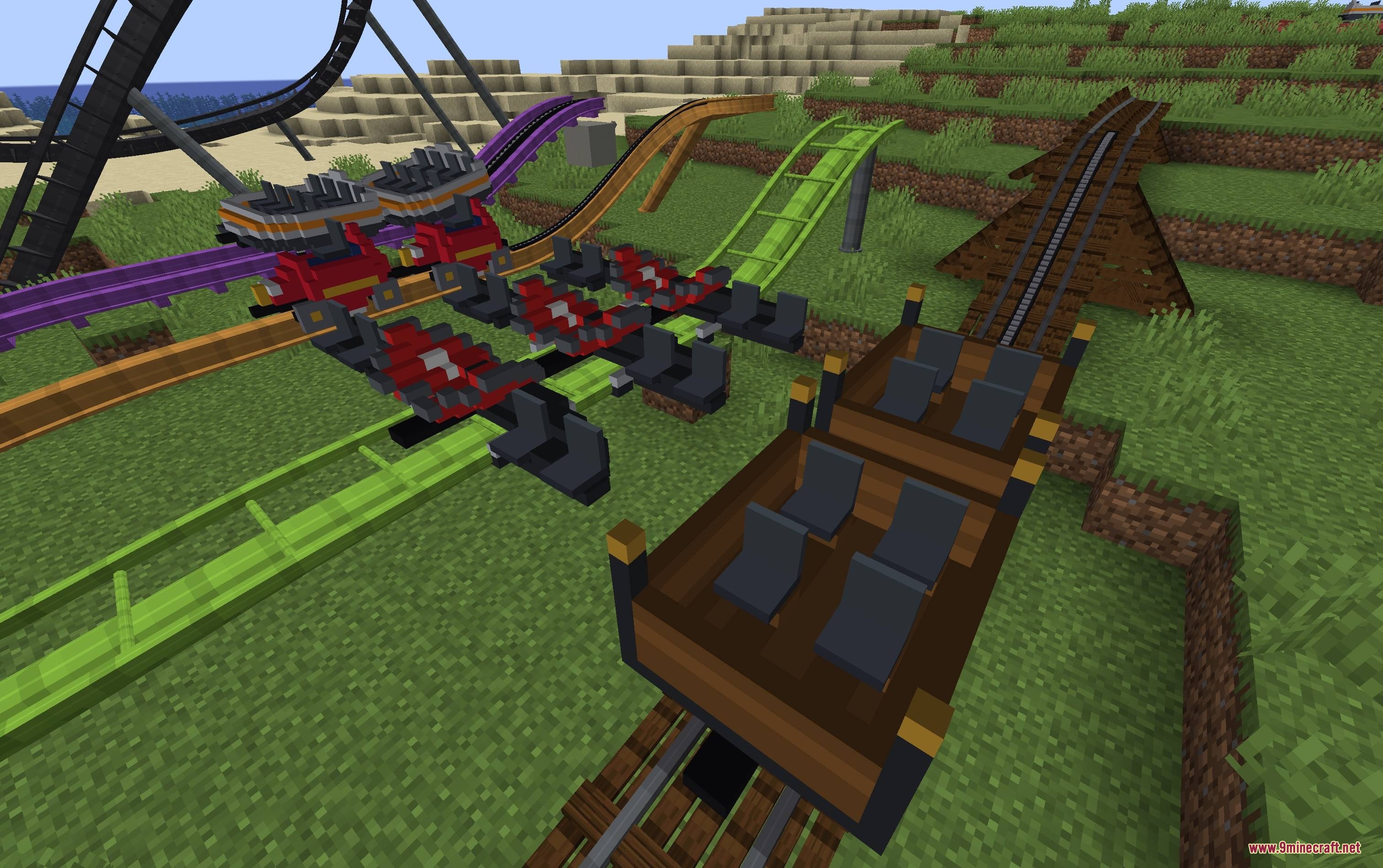 Mine Coasters Mod Screenshot 4 Showcasing various colorful roller coaster tracks and custom cars on a field