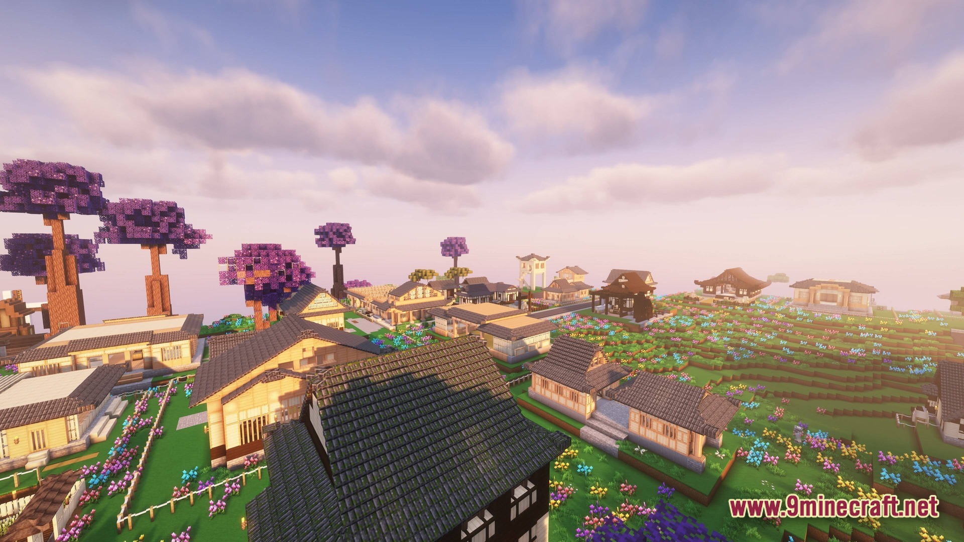 Mine Colonies Create & Conquer Modpack Screenshot 9 A Japanese-style village with wooden houses and purple trees situated in a flowery meadow biome