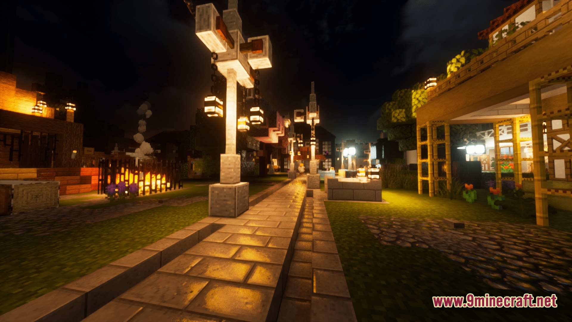 Mine Colonies Dimensional Adventure Modpack Screenshot 10 A stone pathway lined with decorative street lamps illuminates a Minecraft colony at night