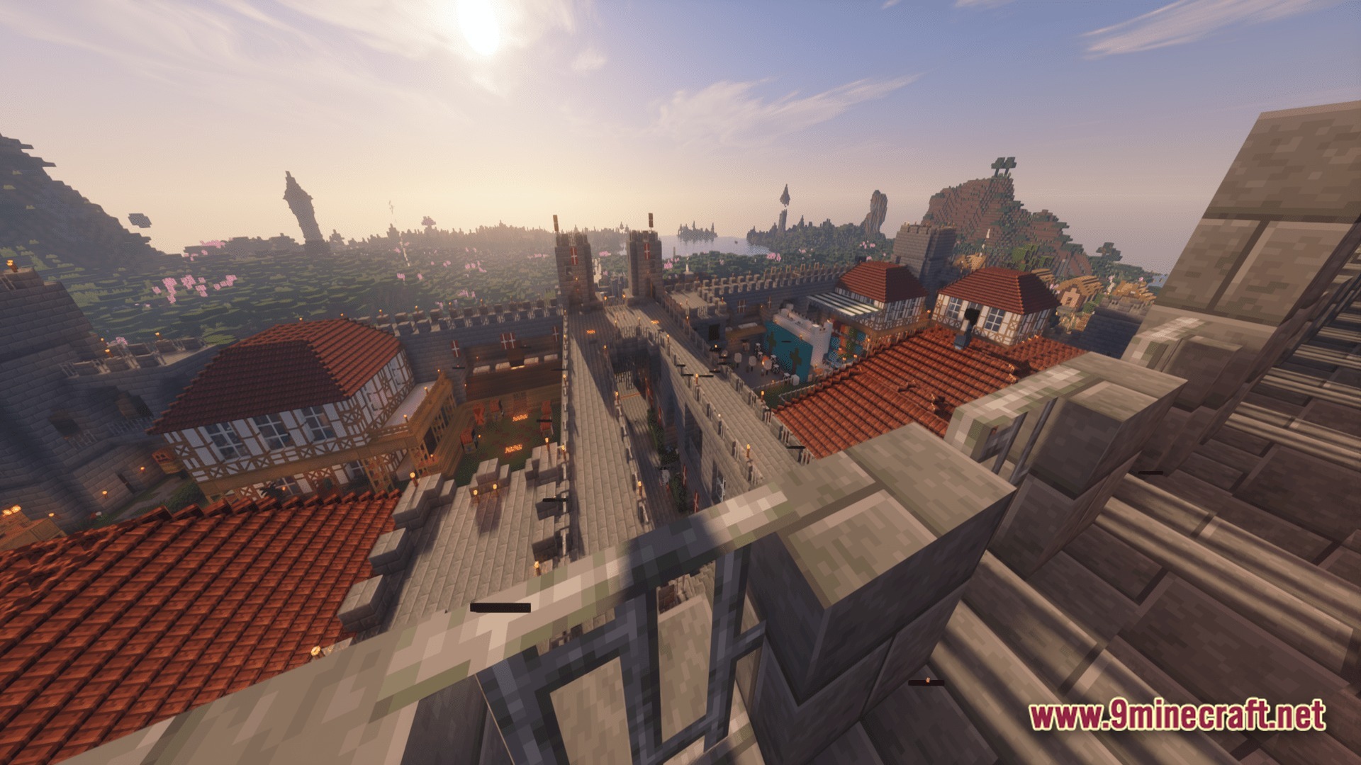 Mine Colonies Dimensional Adventure Modpack Screenshot 8 A medieval fortress with stone walls and red-roofed buildings overlooks a vast landscape at sunset