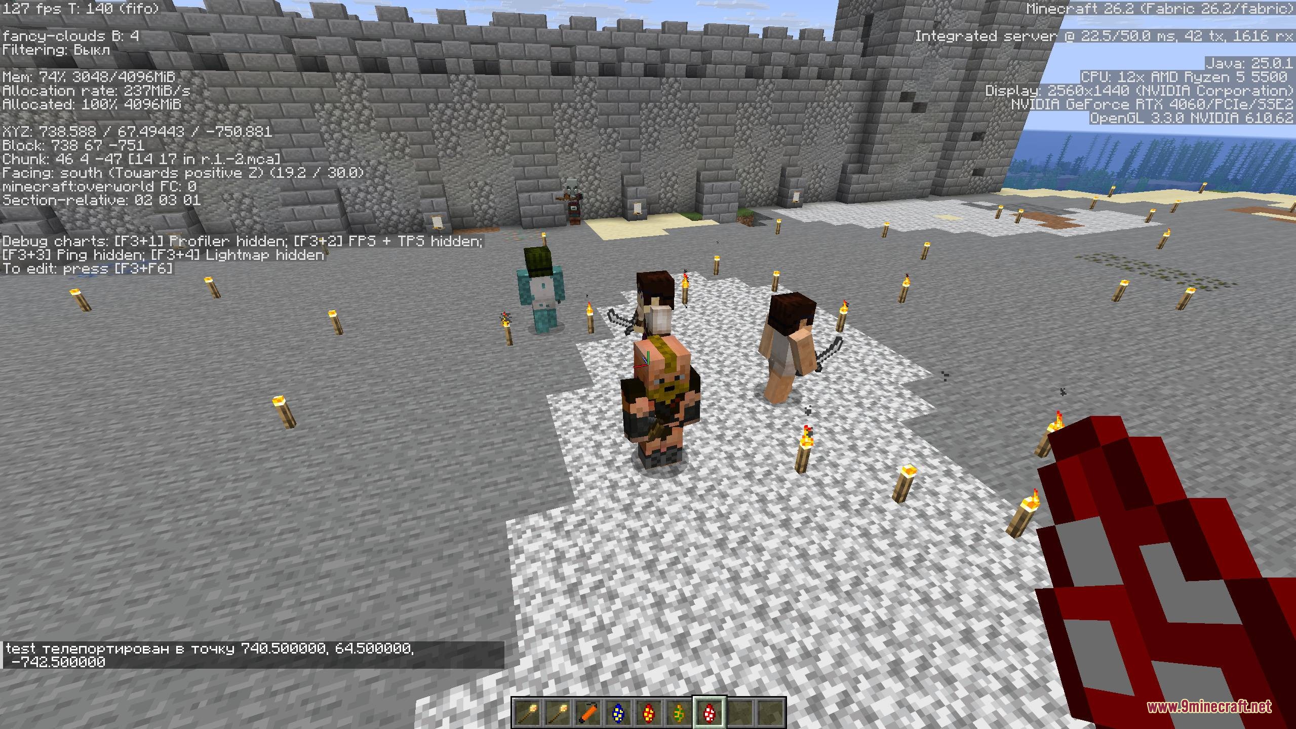 Citizens and a barbarian standing together in a stone courtyard with torches