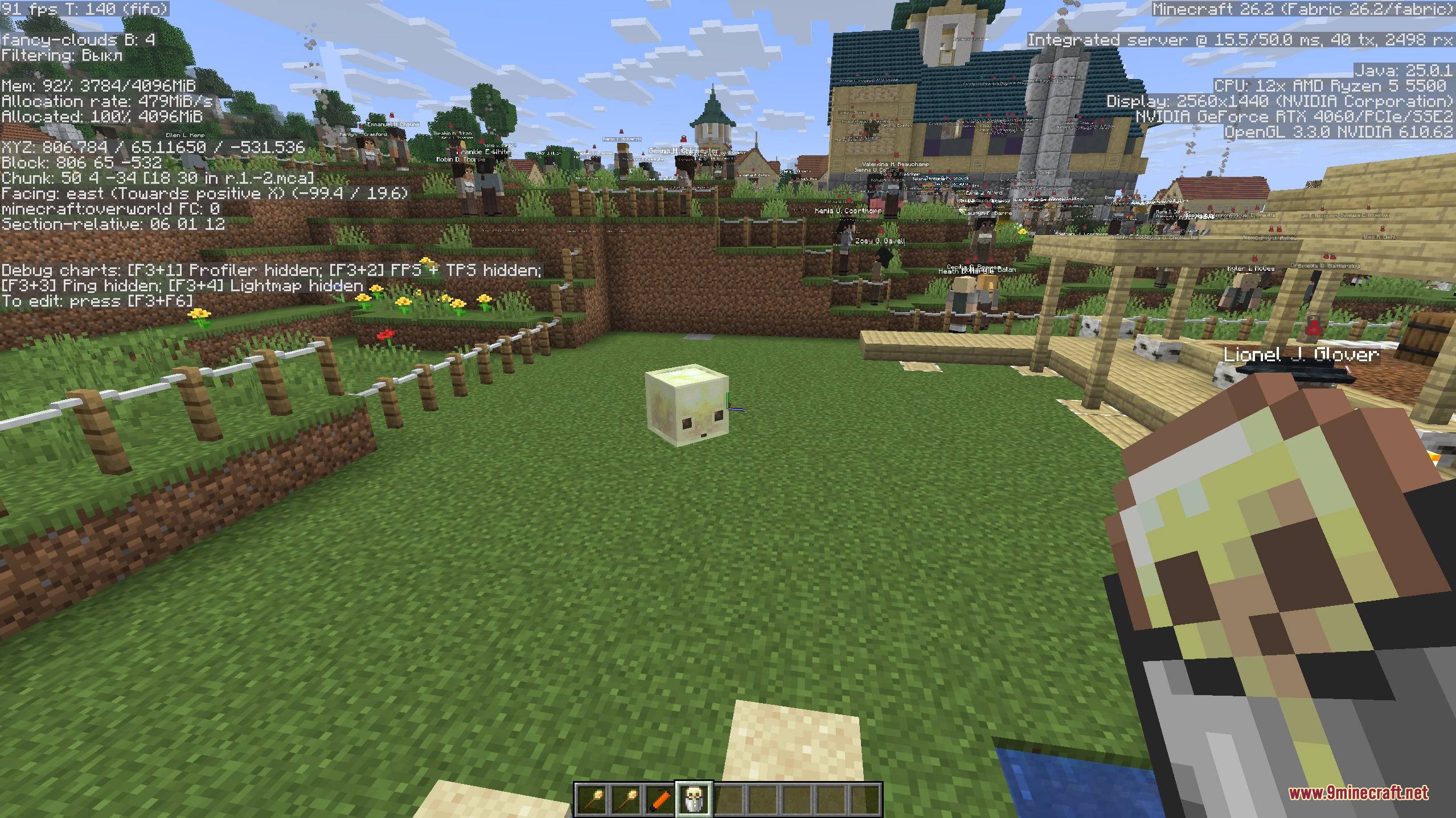 A player holding a bucket with a small creature in a Minecraft colony