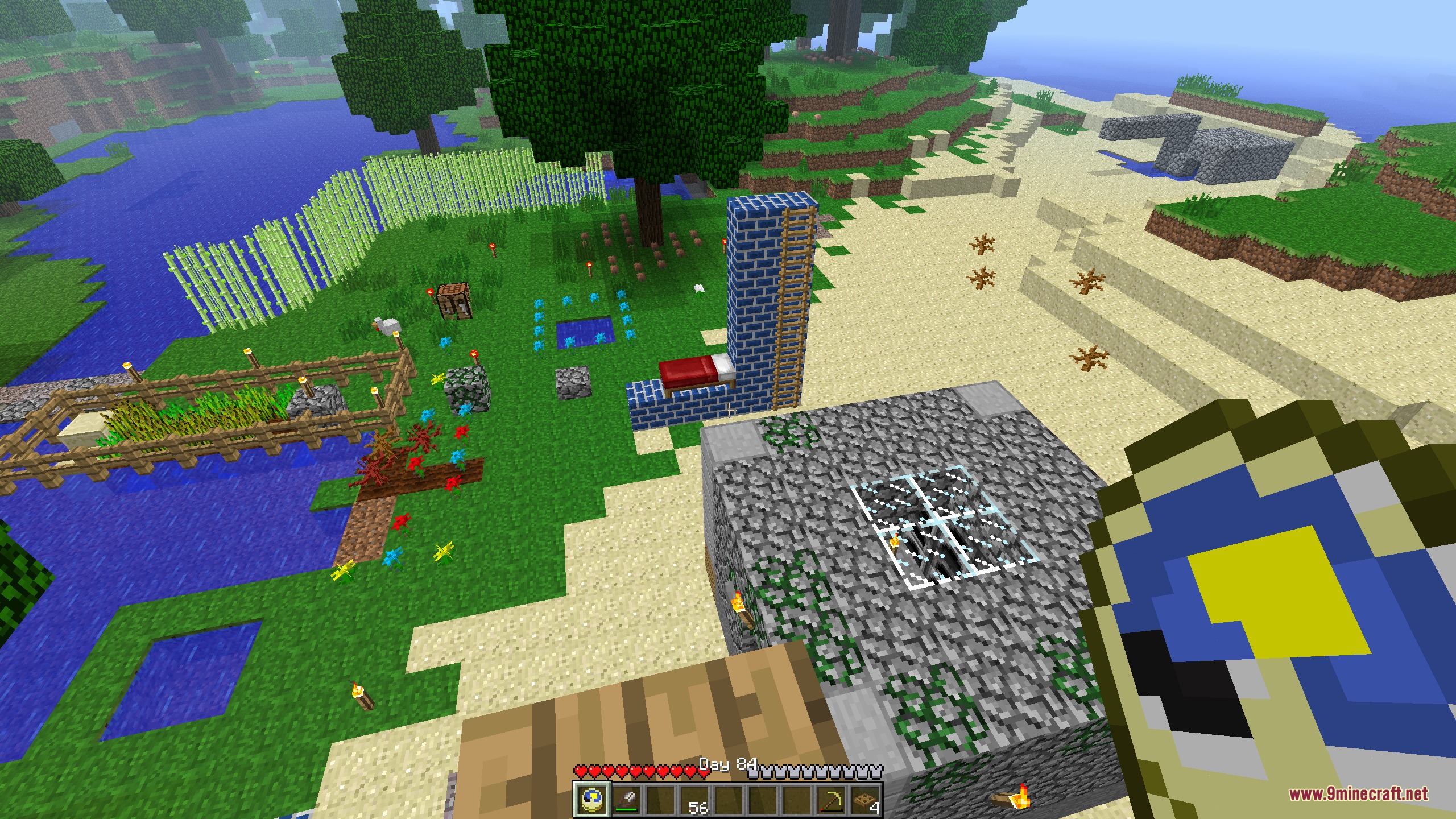 Minecraft Sigma MCS Mod Screenshot 1 Player holding a clock overlooking a base with a tall blue brick tower