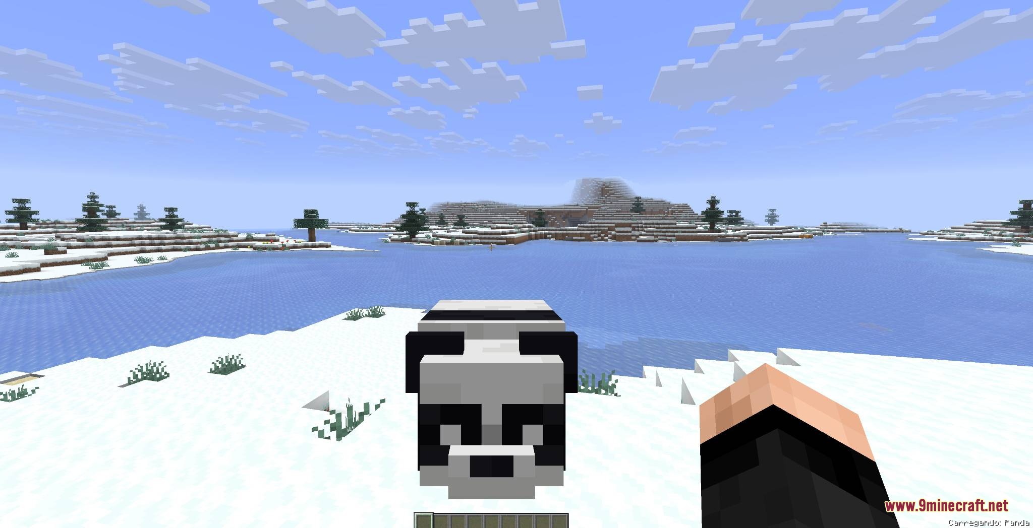Mobs and Villager Mod Screenshot 3 Player holding a large panda in their hands in snowy biome