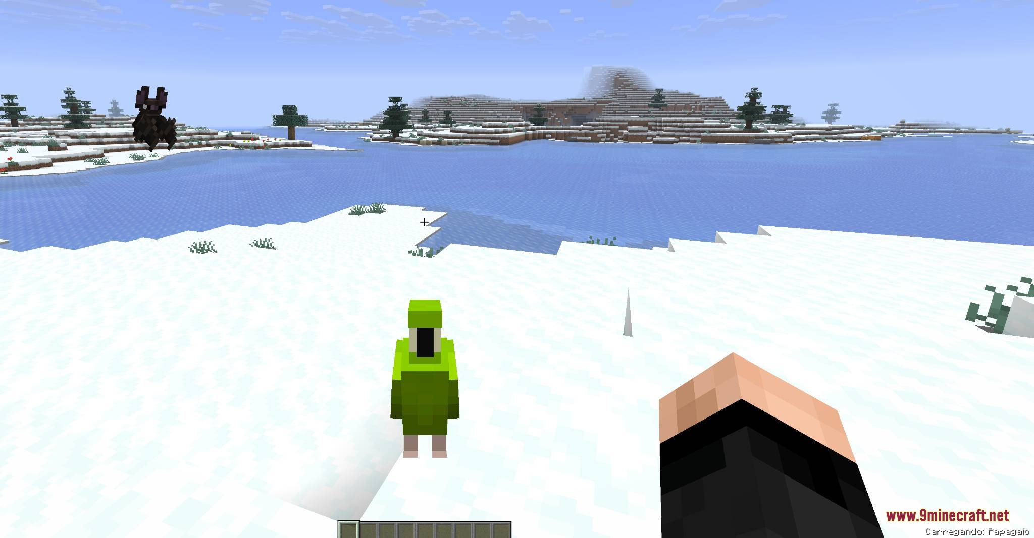 Mobs and Villager Mod Screenshot 4 Player carrying a small green parrot across a snowy landscape