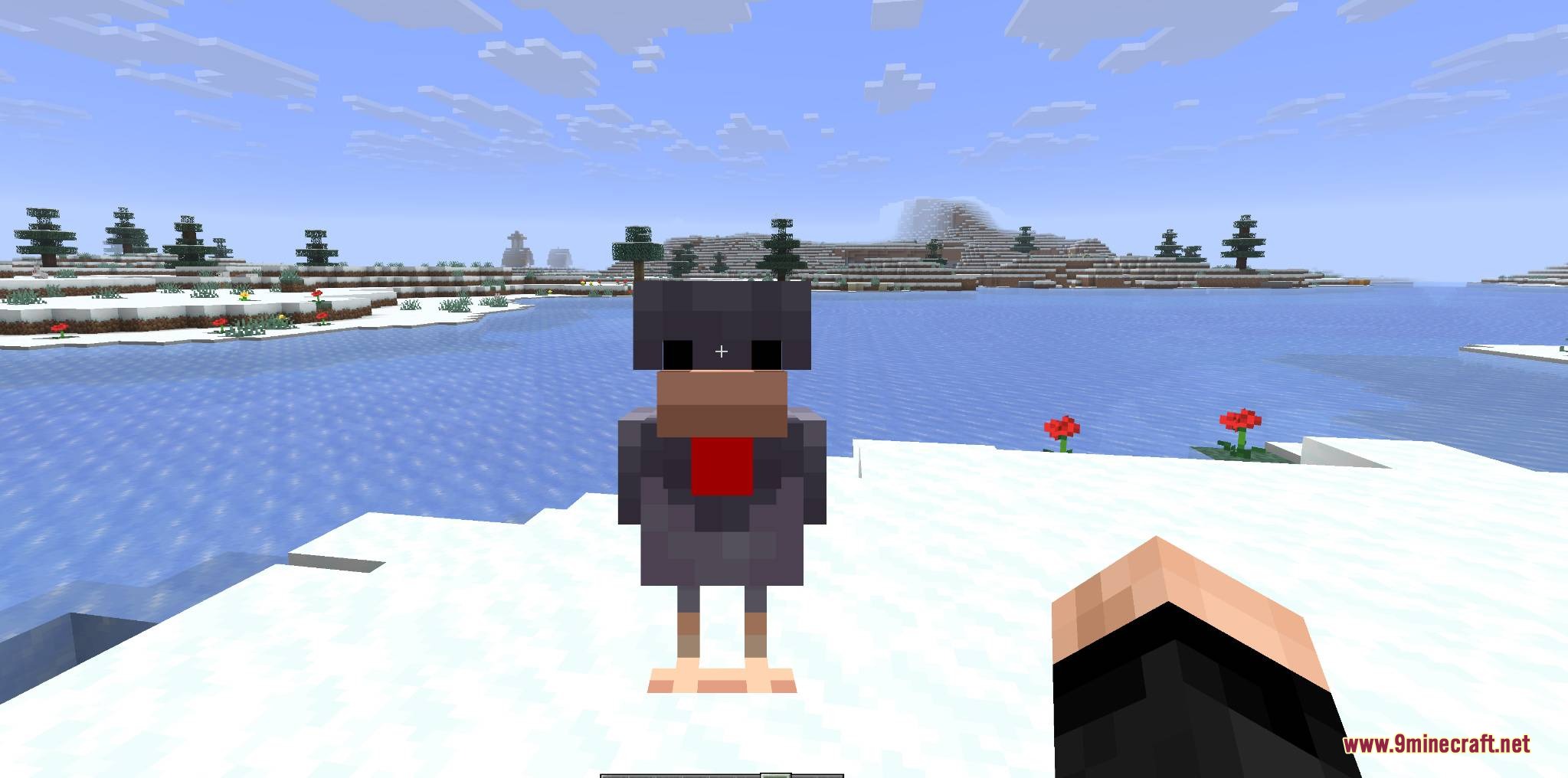 Mobs and Villager Mod Screenshot 7 A player holding a chicken in their hands in a snowy biome