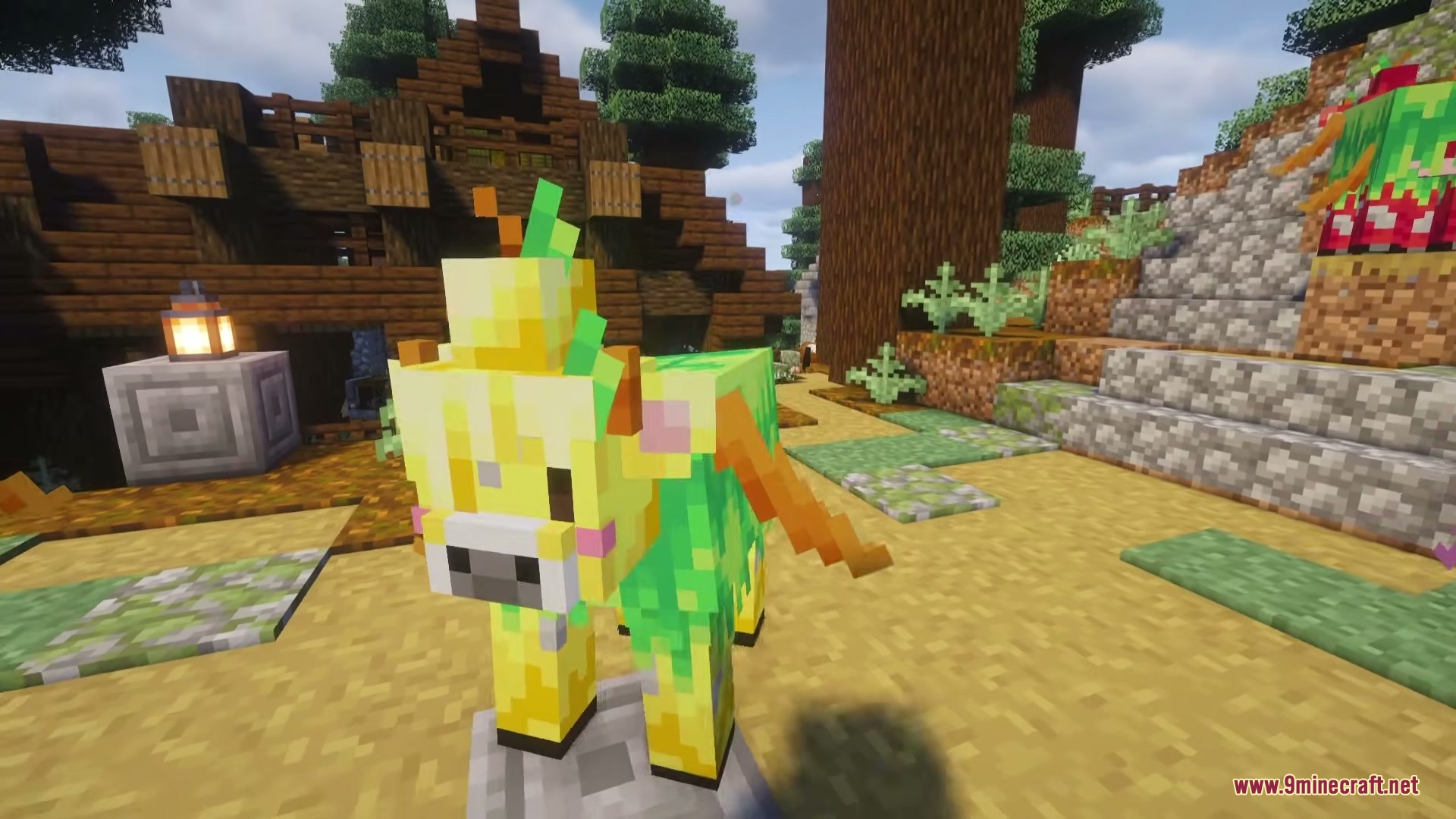 A golden apple cow with green leaves on its head near a building