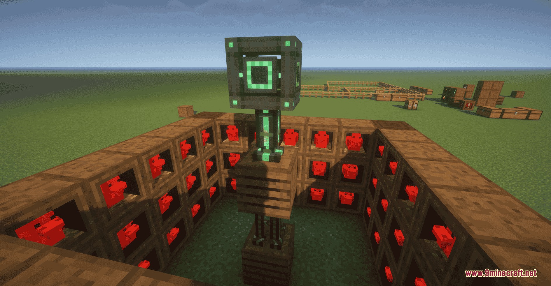 A farm of red chickens in roosts surrounding a central technical machine