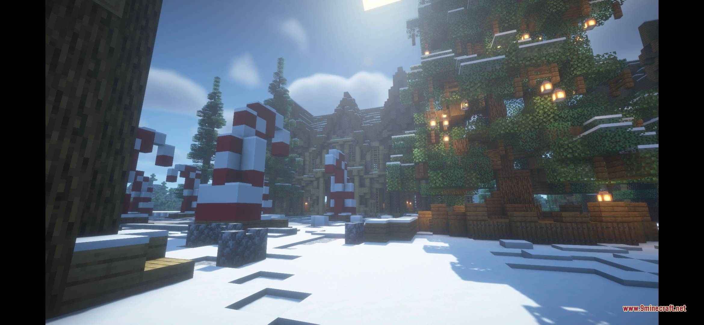 Moog's Seasonal Expansion a Moogmas Miracle Data Pack Screenshot 2 Giant candy canes and a decorated Christmas tree in a snowy Minecraft landscape