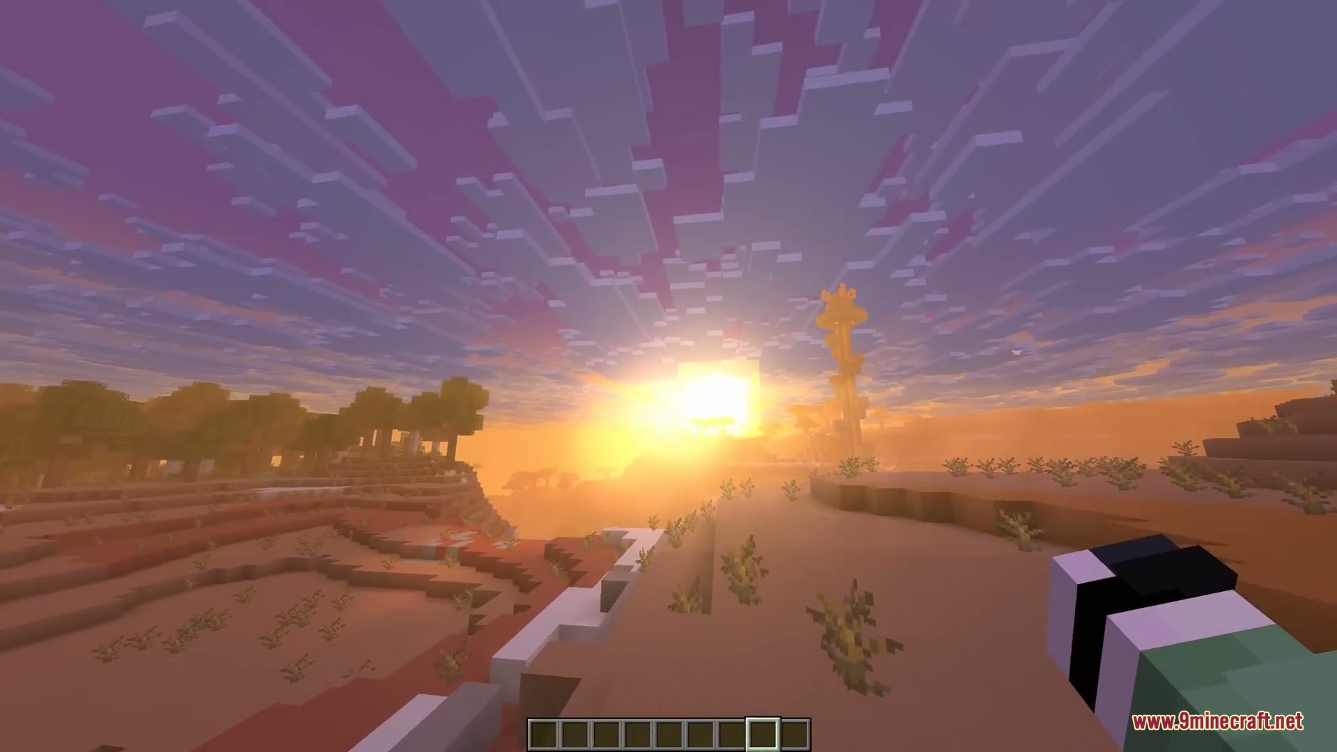 More Cloud Layers Mod Screenshot 5 The sun sets over a desert landscape with many layers of blocky clouds