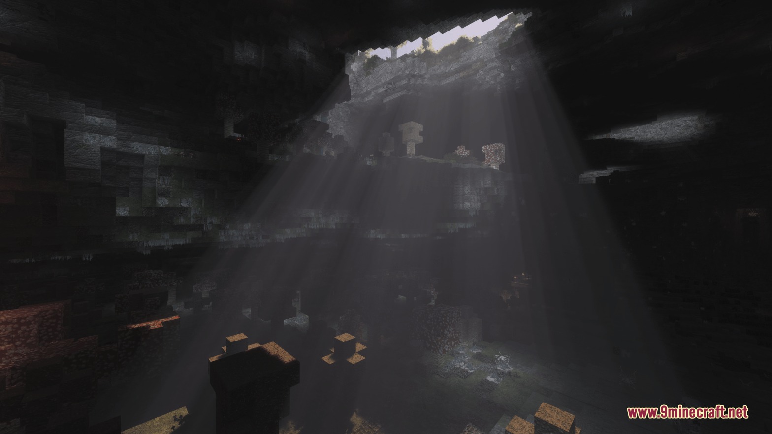Mostly True Beneath Resource Pack Screenshot 5 Sunlight beams through a ceiling opening into a dark and realistic cavern