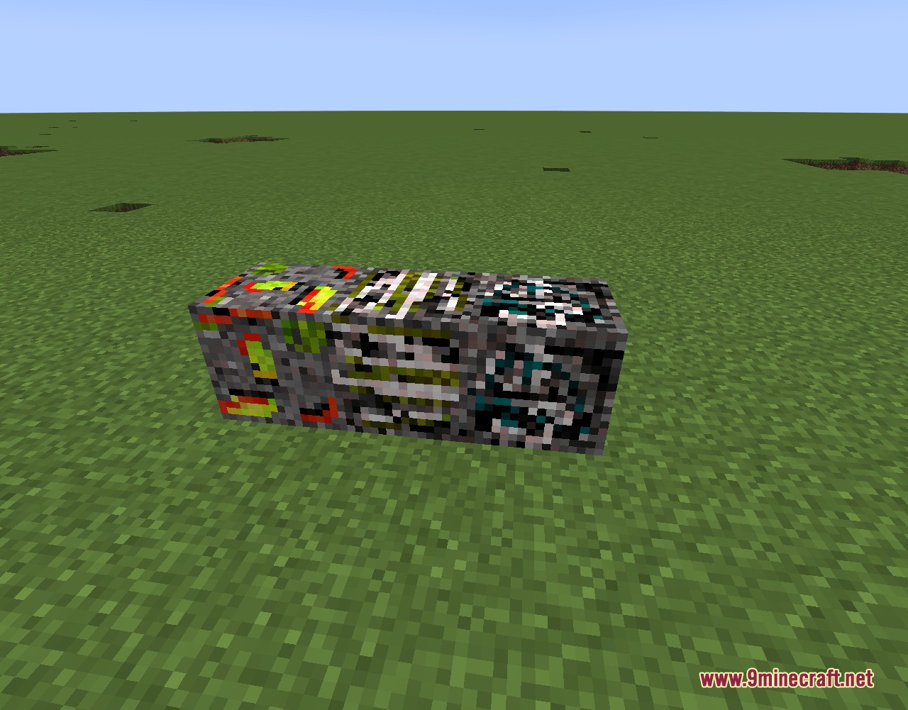 Motball Craft Mod Screenshot 6 Four colorful portal ore blocks from the Motball Craft Mod on grass