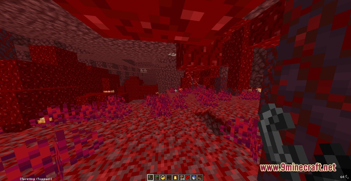 Low fire burning on the ground in a crimson forest nether biome