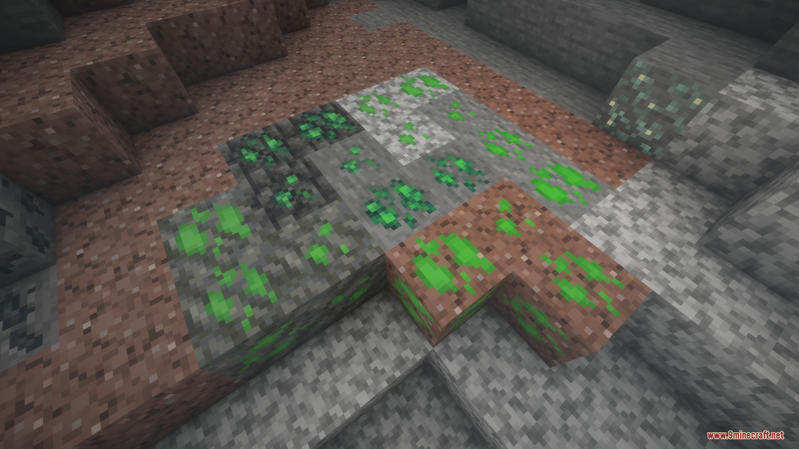 Green ore veins blending into granite diorite andesite and tuff blocks