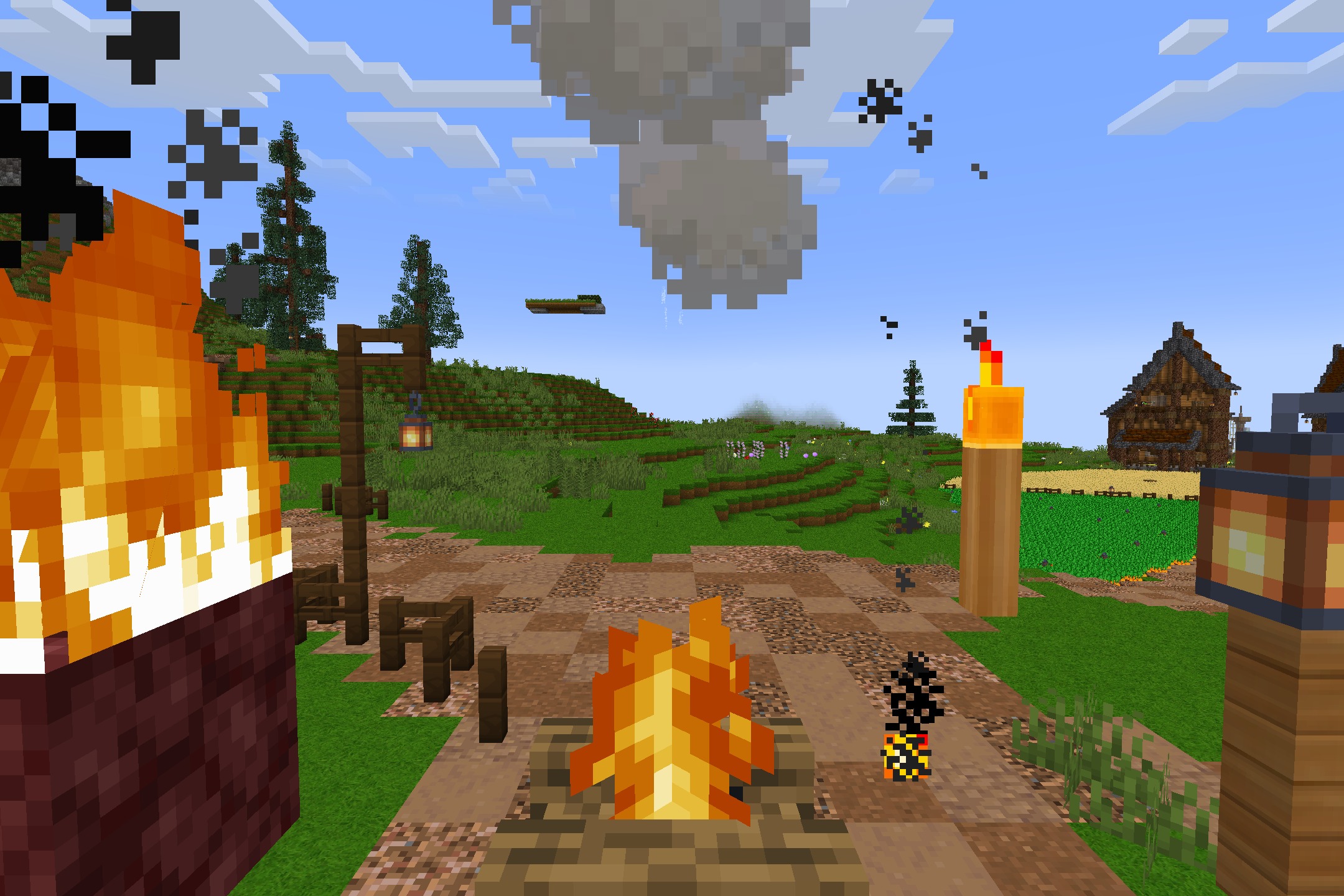 Campfires and lanterns illuminate a village path with custom cartoon textures