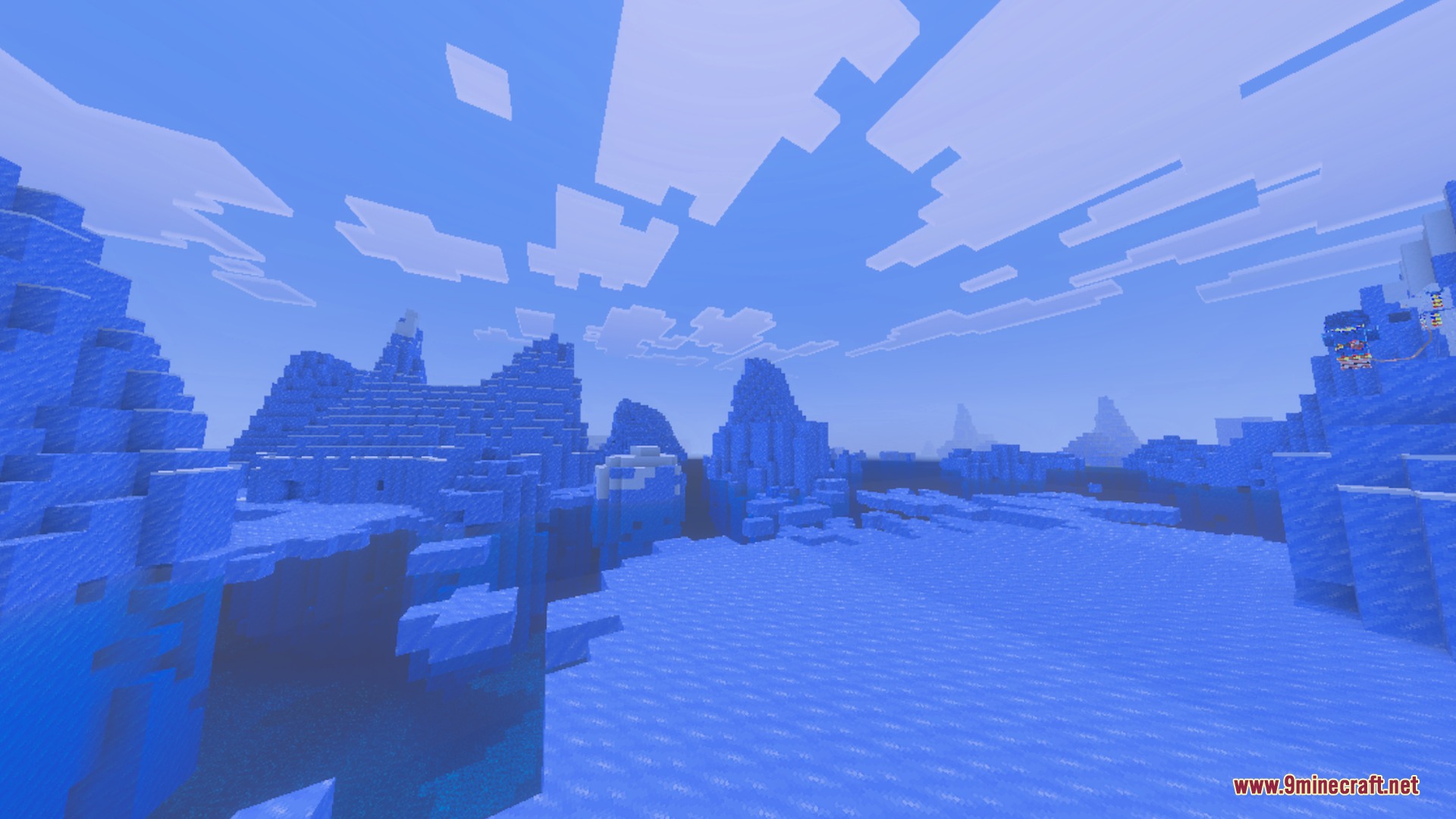 Vibrant blue ice spikes biome under a bright sky with blocky white clouds