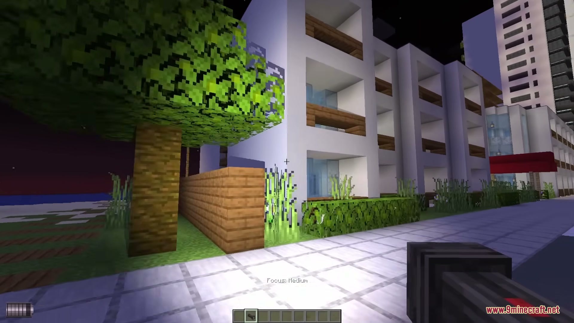 Omega Flashlight Mod Screenshot 3 Omega Flashlight Mod casting a medium focused beam on a tree and building