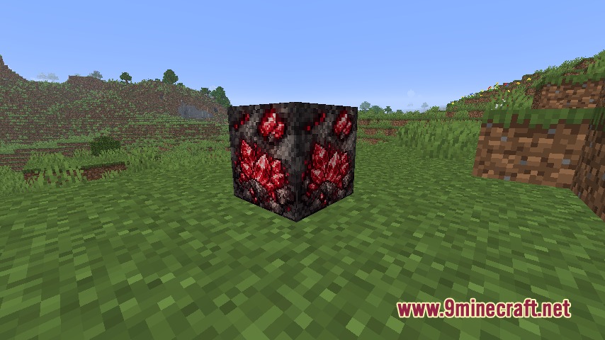 Ore Genesis Mod Screenshot 6 A rubium ore block with red crystals placed on a green grass field