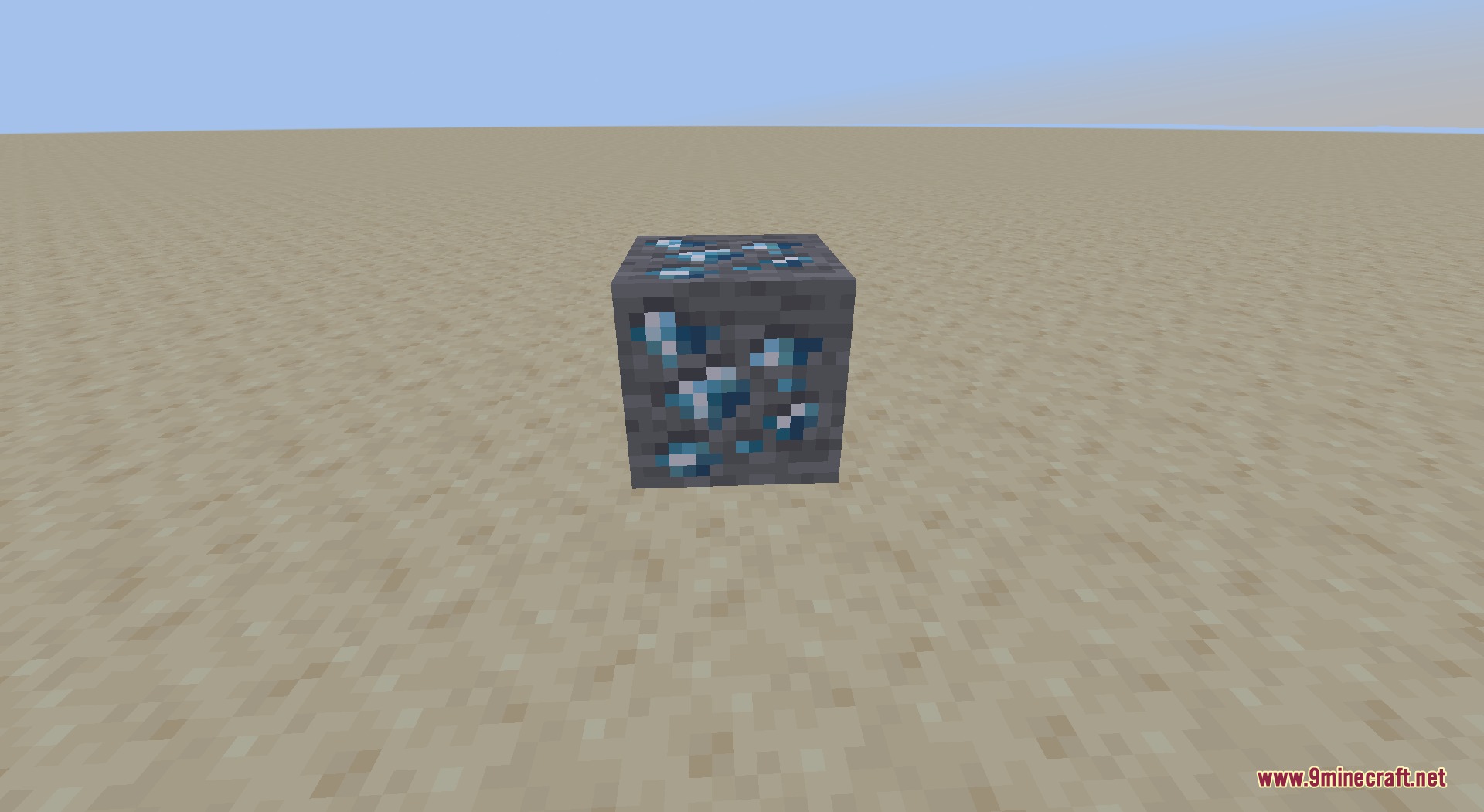 Ore Genesis Mod Screenshot 8 A block of sapphire ore placed on the ground in a desert